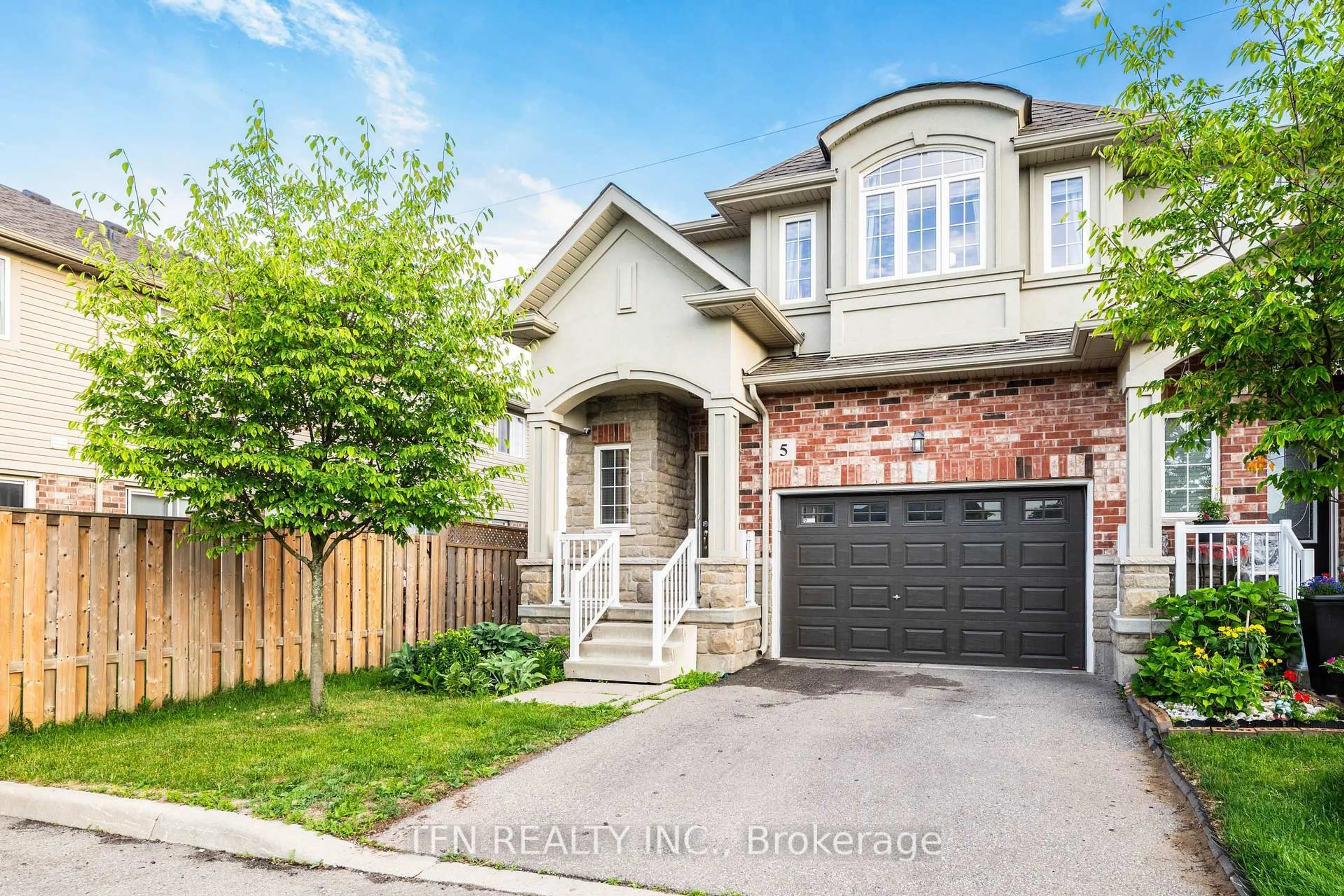 Home with brick exterior material, street for 73 Medici Lane #5, Hamilton Ontario L9B 0H2