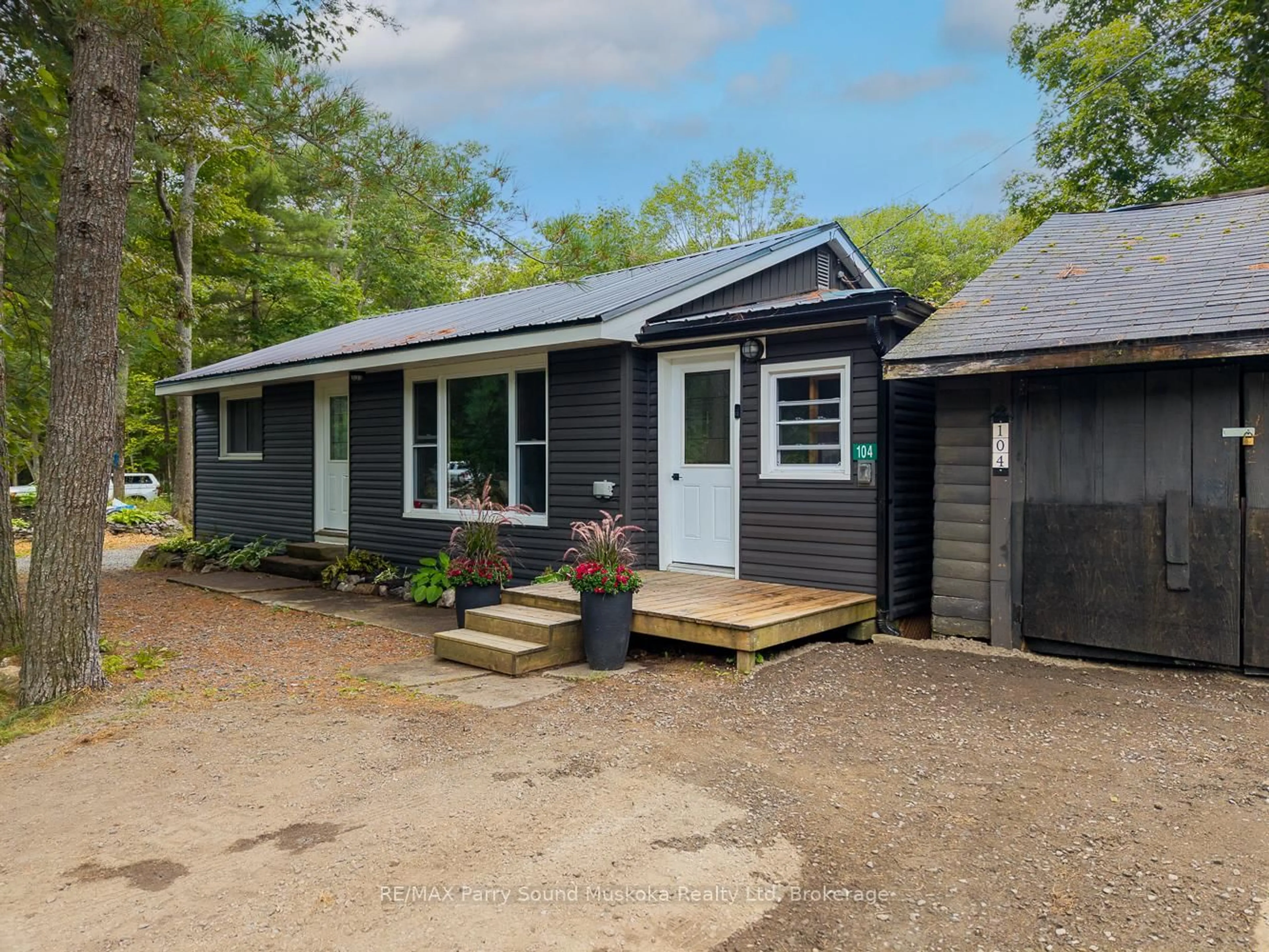 A pic from outside/outdoor area/front of a property/back of a property/a pic from drone, street for 104 Parry Sound Dr, McDougall Ontario P2A 2W7