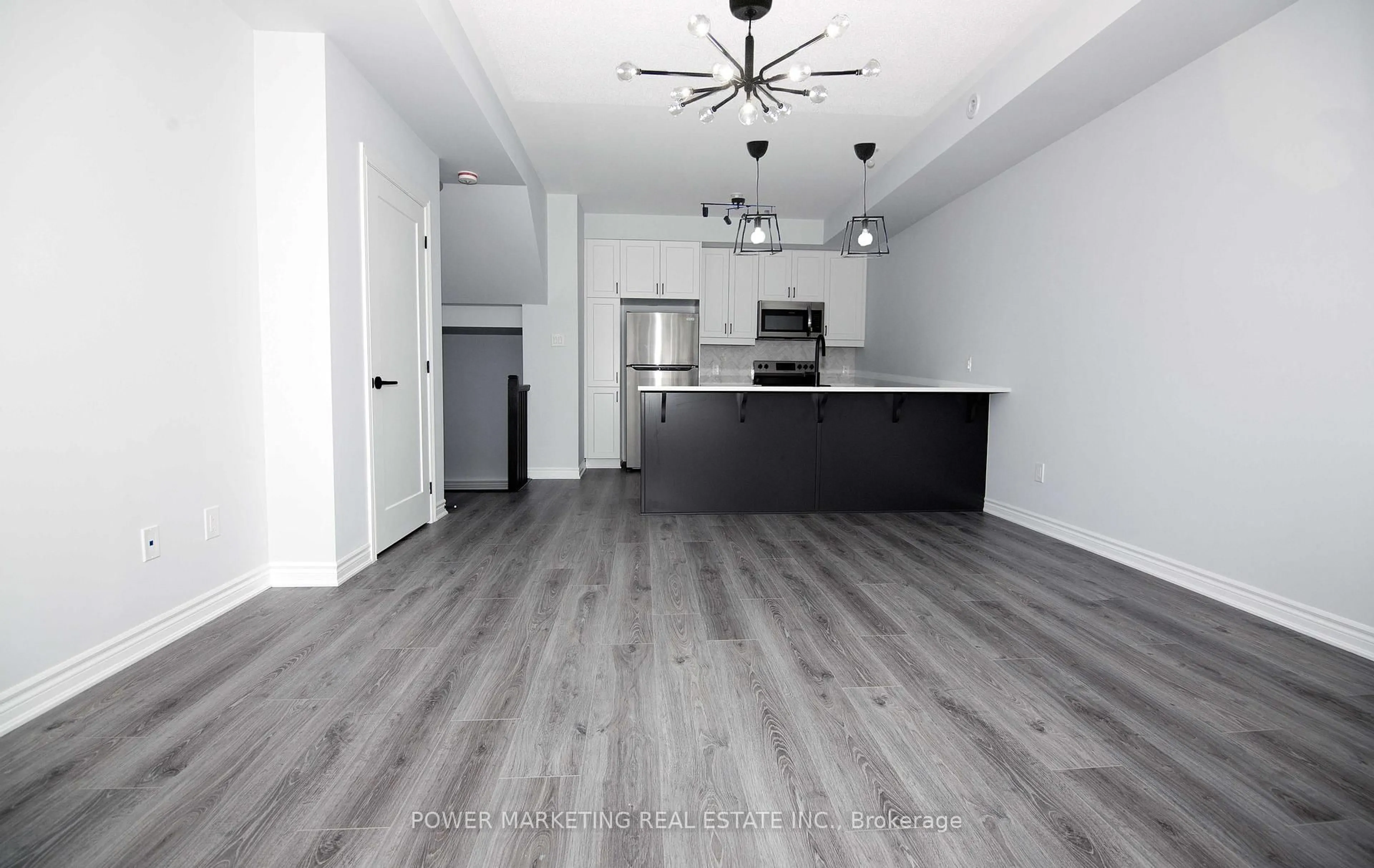 Open concept kitchen, wood/laminate floor for 533 Takamose Private, Ottawa Ontario K1K 5A5
