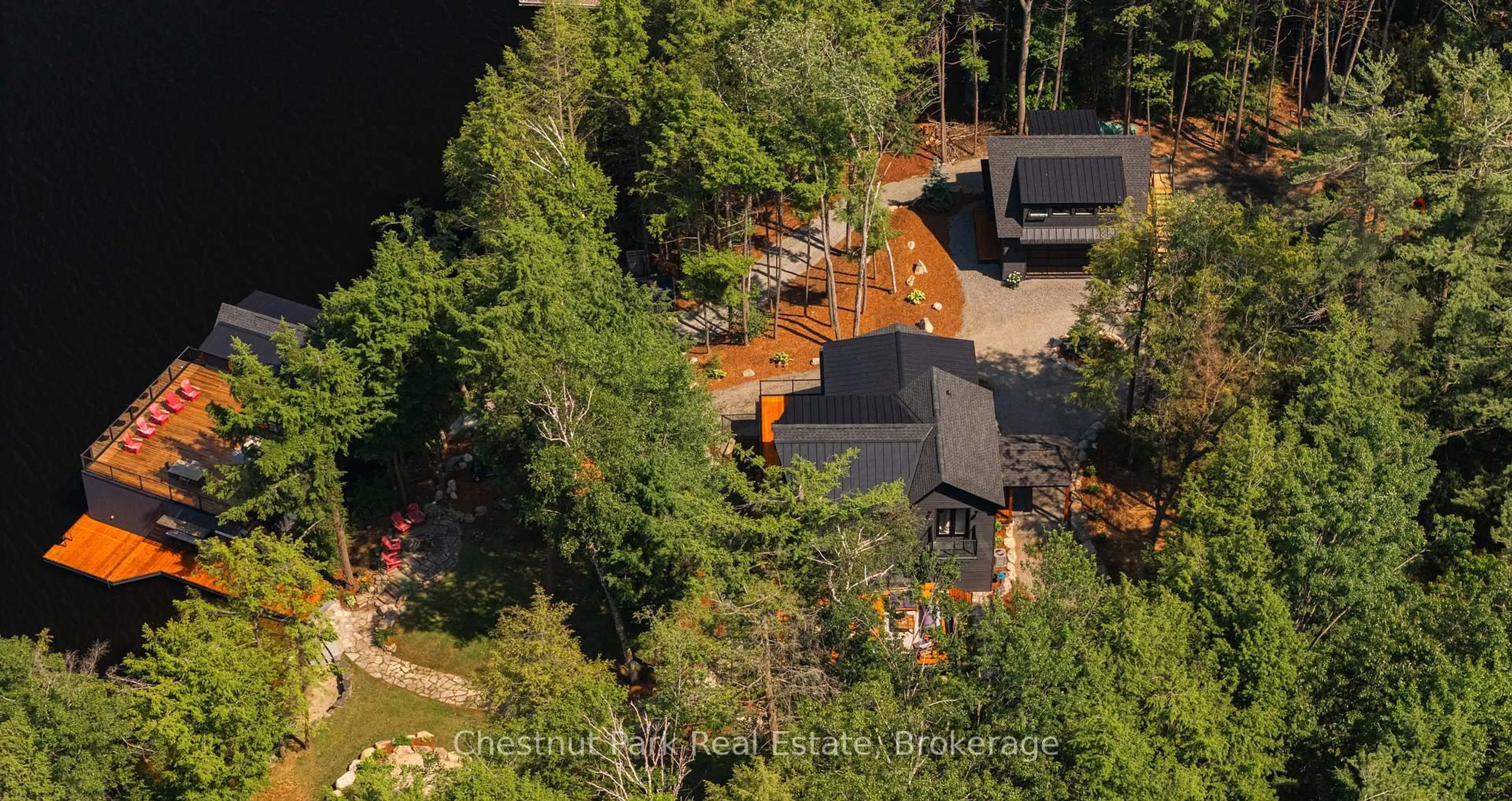 A pic from outside/outdoor area/front of a property/back of a property/a pic from drone, forest/trees view for 6 Taylor Island 26LM, Gravenhurst Ontario P1P 1R2