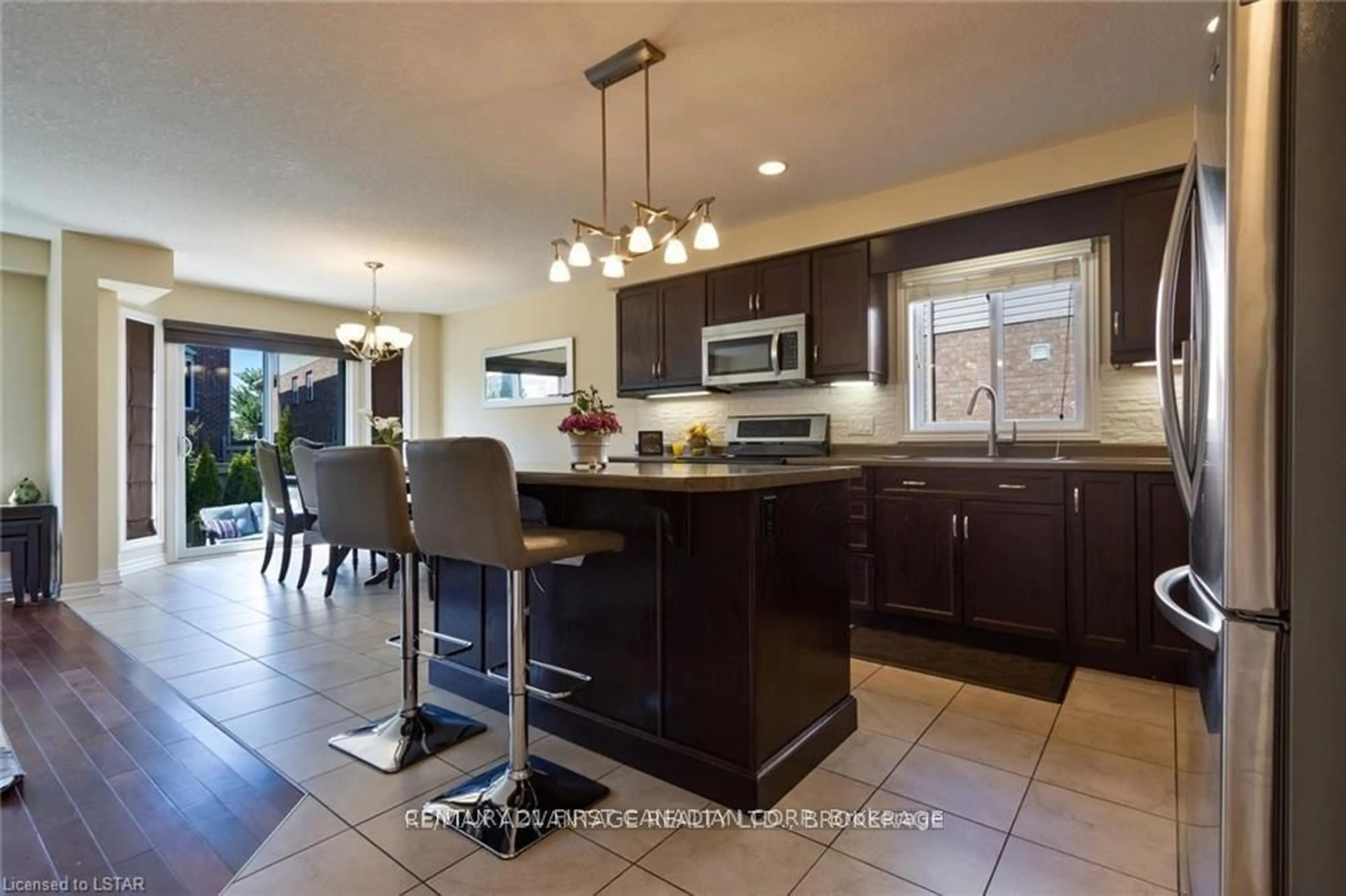 Open concept kitchen, ceramic/tile floor for 3131 Emily Carr Lane, London South Ontario N6L 0B3