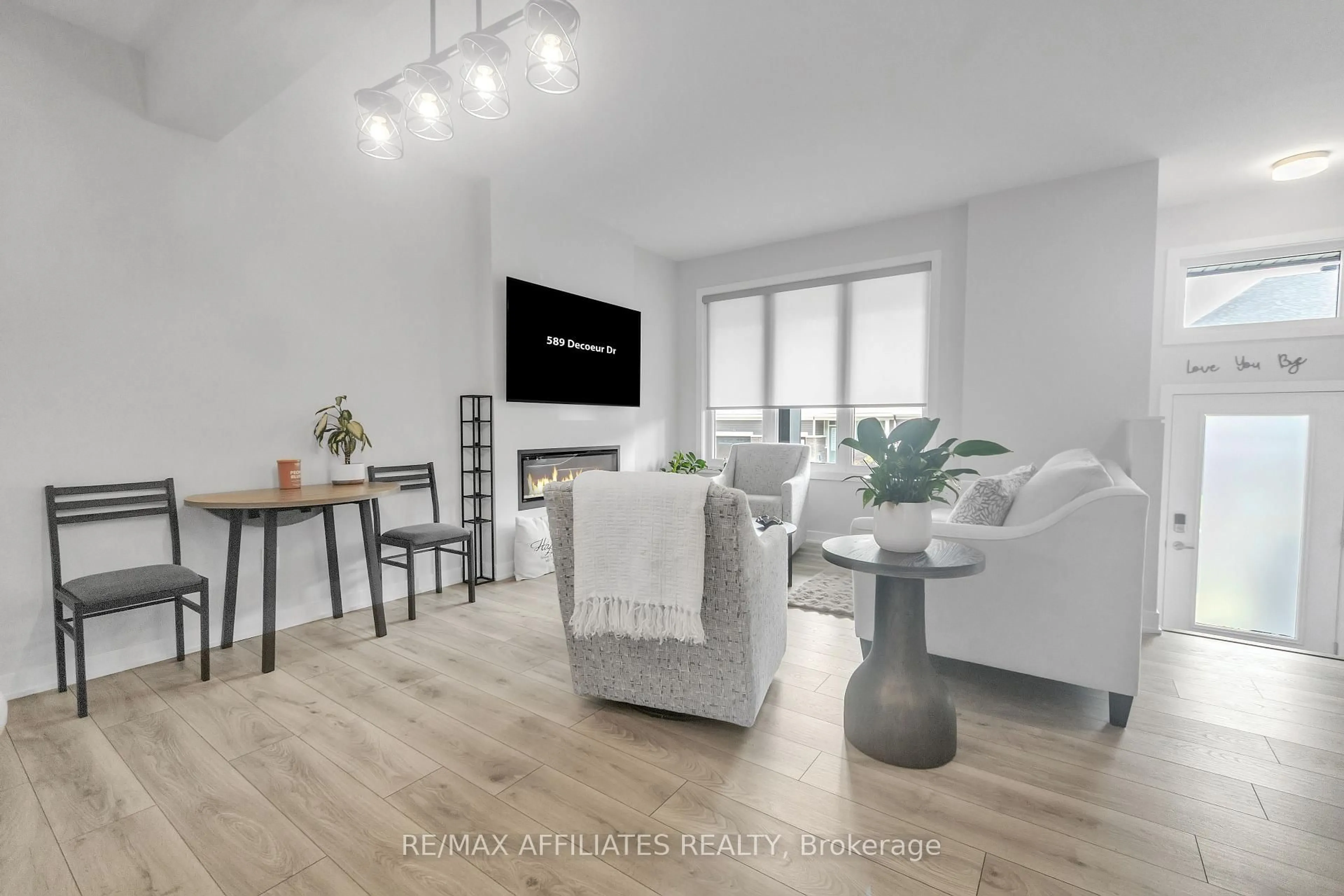 Living room with furniture, wood/laminate floor for 189 Beebalm Cres, Ottawa Ontario K2J 7G9