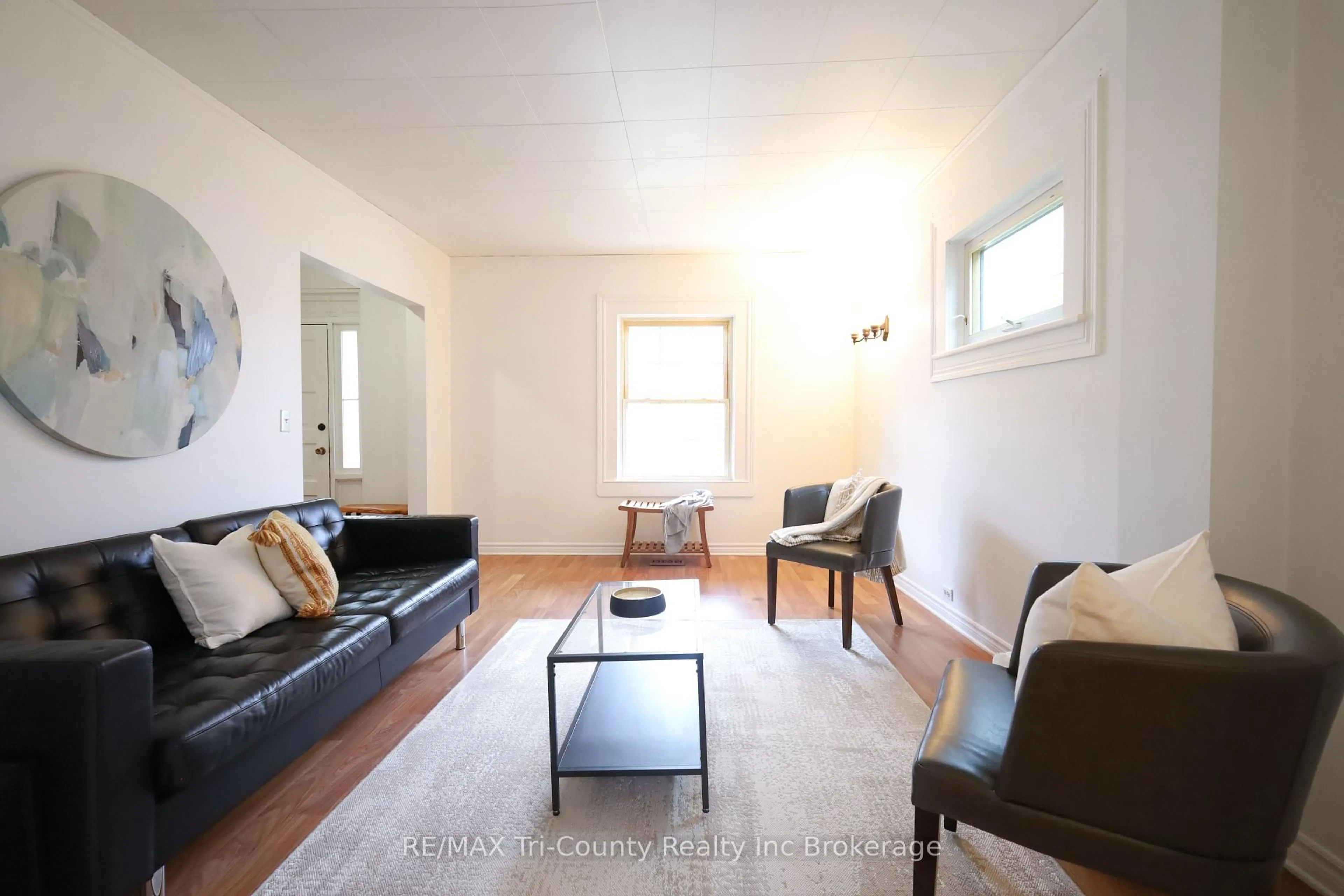 Living room with furniture, wood/laminate floor for 60 Manitoba St, St. Thomas Ontario N5P 3A4