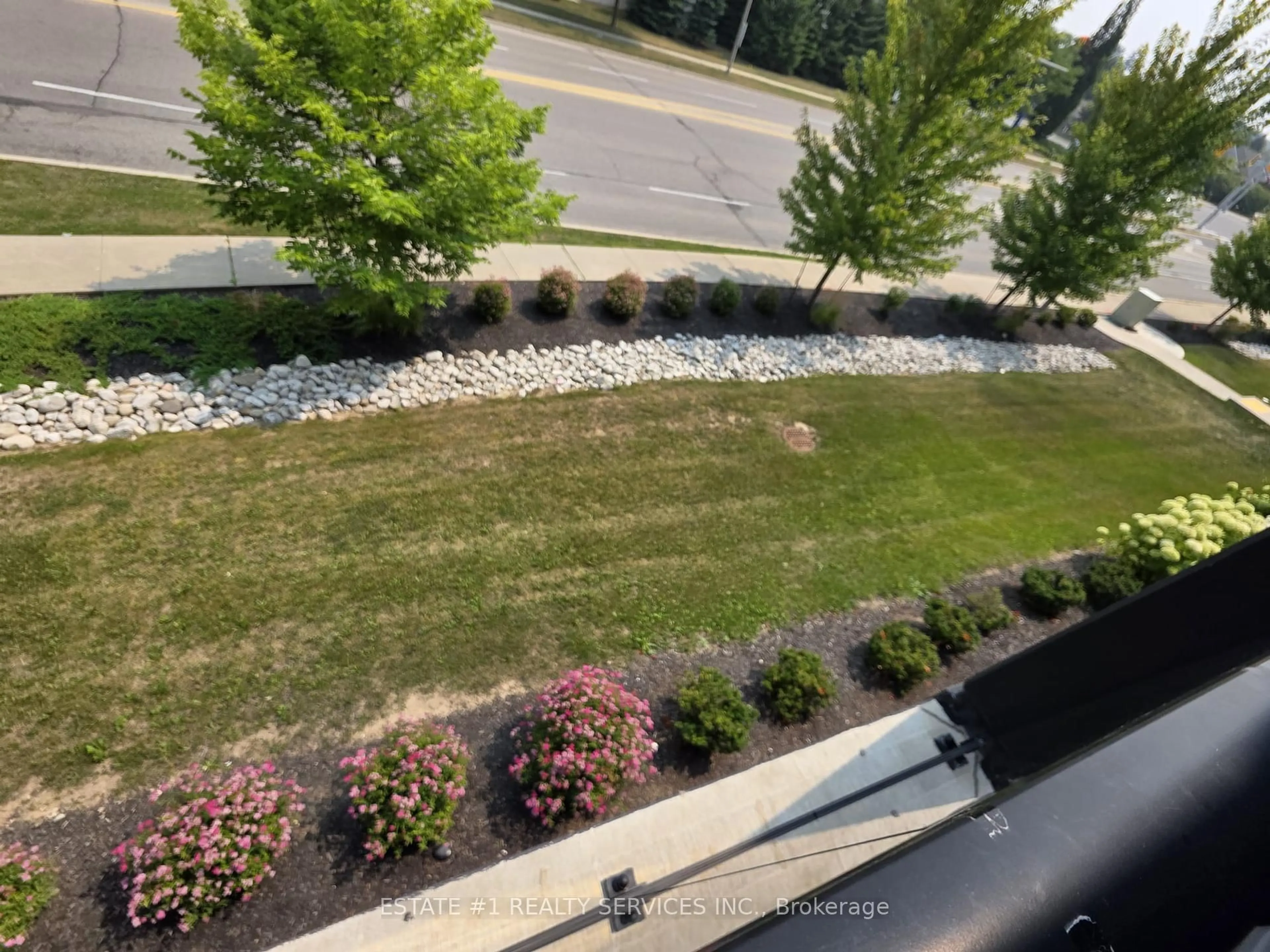 A pic from outside/outdoor area/front of a property/back of a property/a pic from drone, water/lake/river/ocean view for 5 Wake Robin Dr #203, Kitchener Ontario N2E 0H6