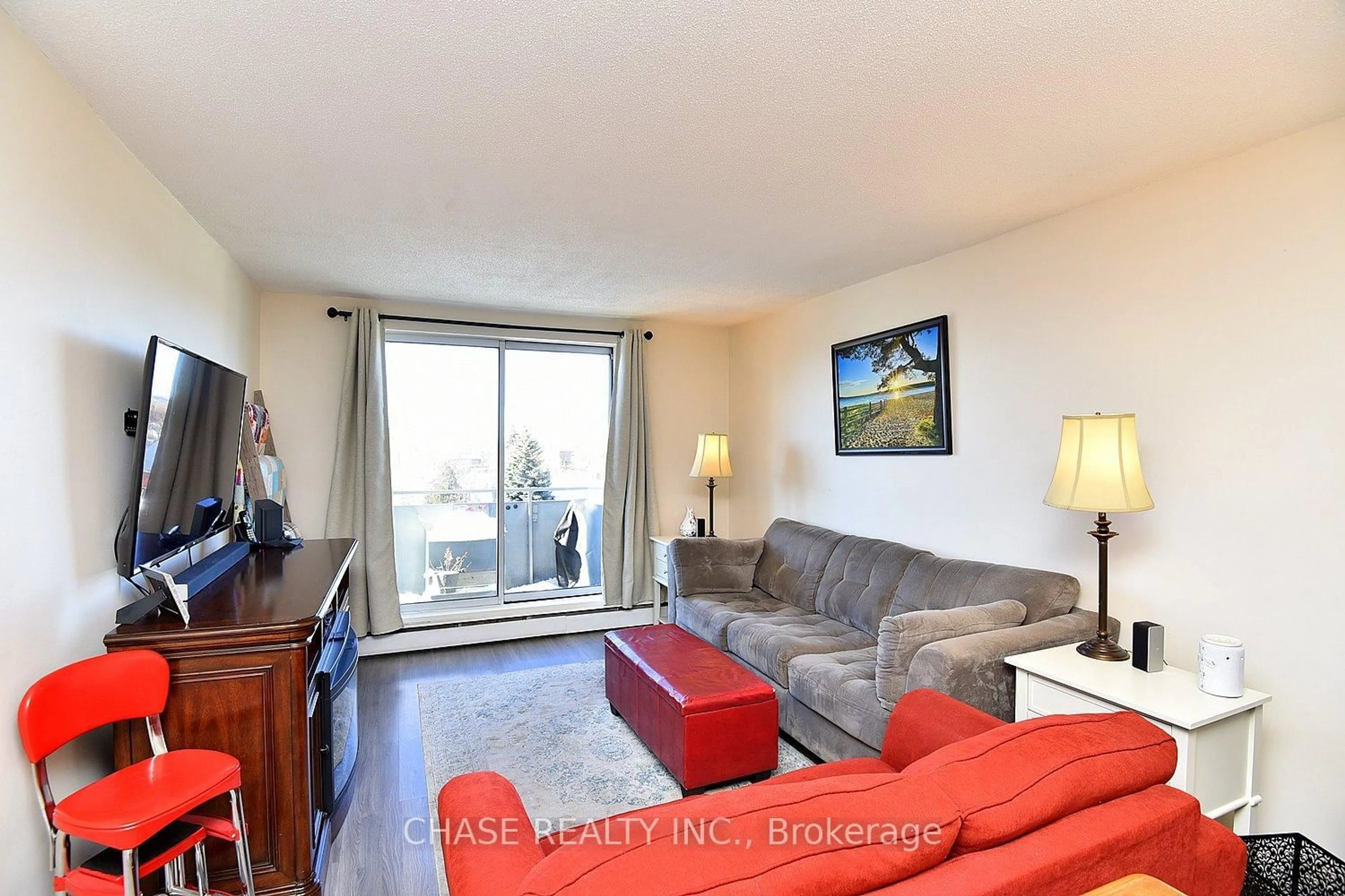 Living room with furniture, wood/laminate floor for 893 Concession St #303, Hamilton Ontario L8V 1E7