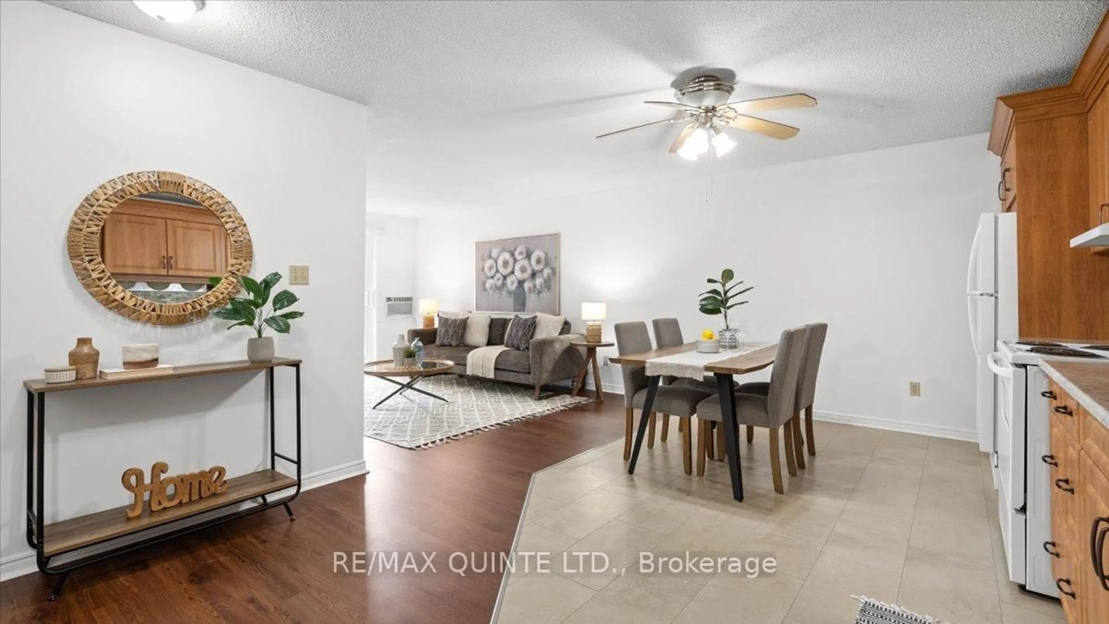 Living room with furniture, wood/laminate floor for 223 North Park St #106D, Belleville Ontario K8P 5A7