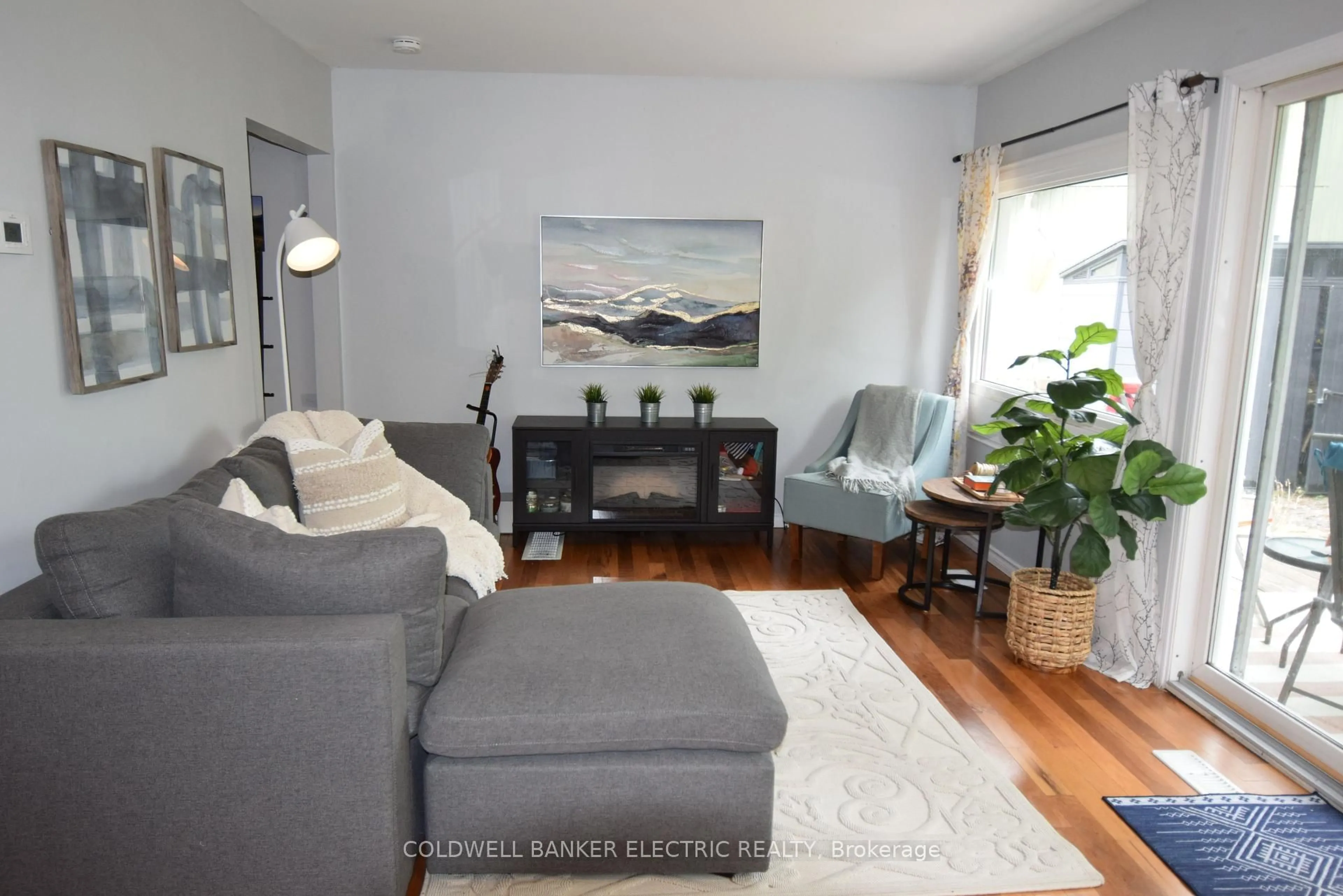Living room with furniture, wood/laminate floor for 32 Jackson Rd, Trent Hills Ontario K0L 1Y0