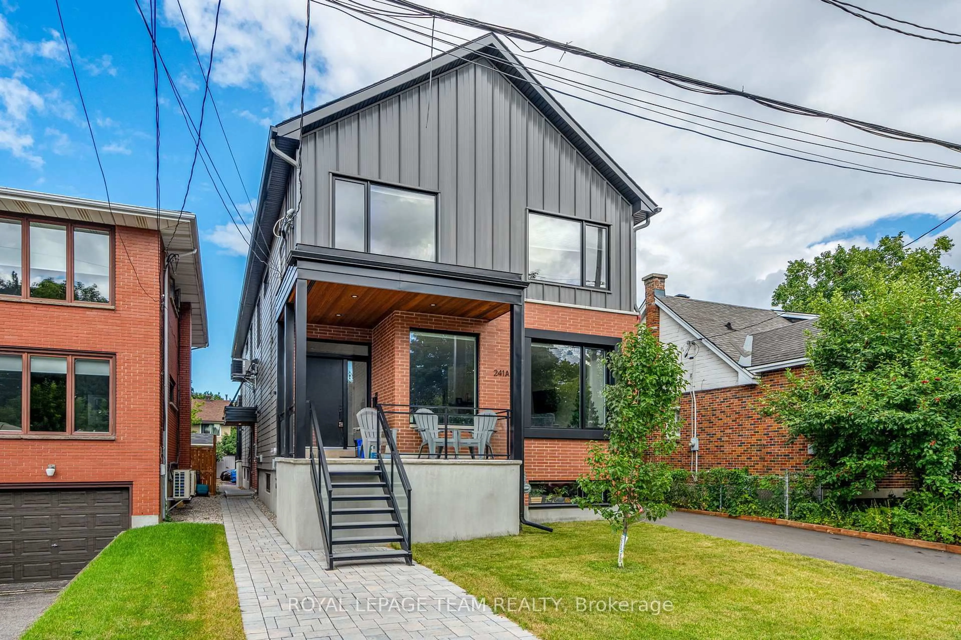 Home with brick exterior material, street for 241 Breezehill Ave #A/A2, Ottawa Ontario K1Y 2J2