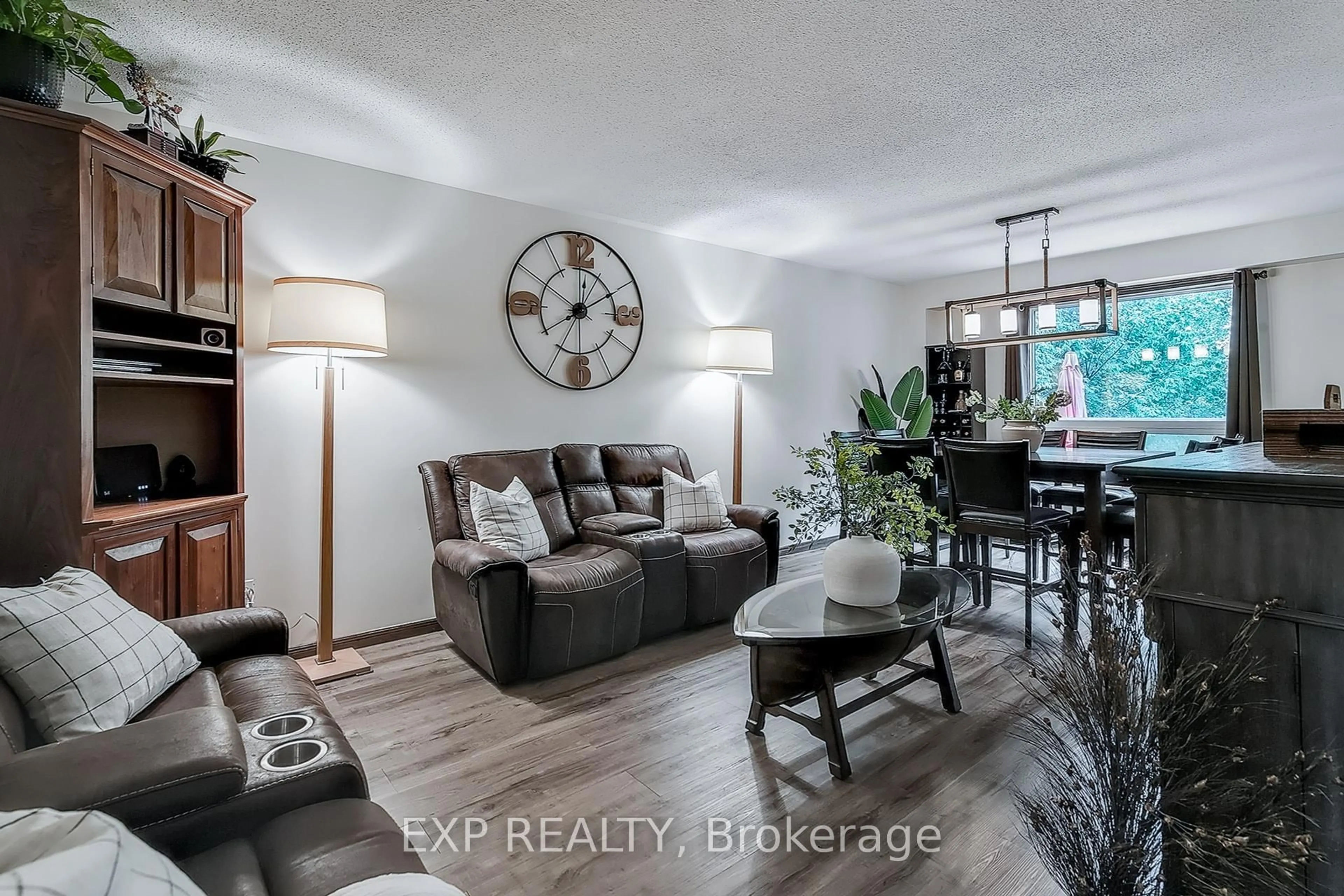 Living room with furniture, wood/laminate floor for 67 Kara Lane, Tillsonburg Ontario N4G 5M2