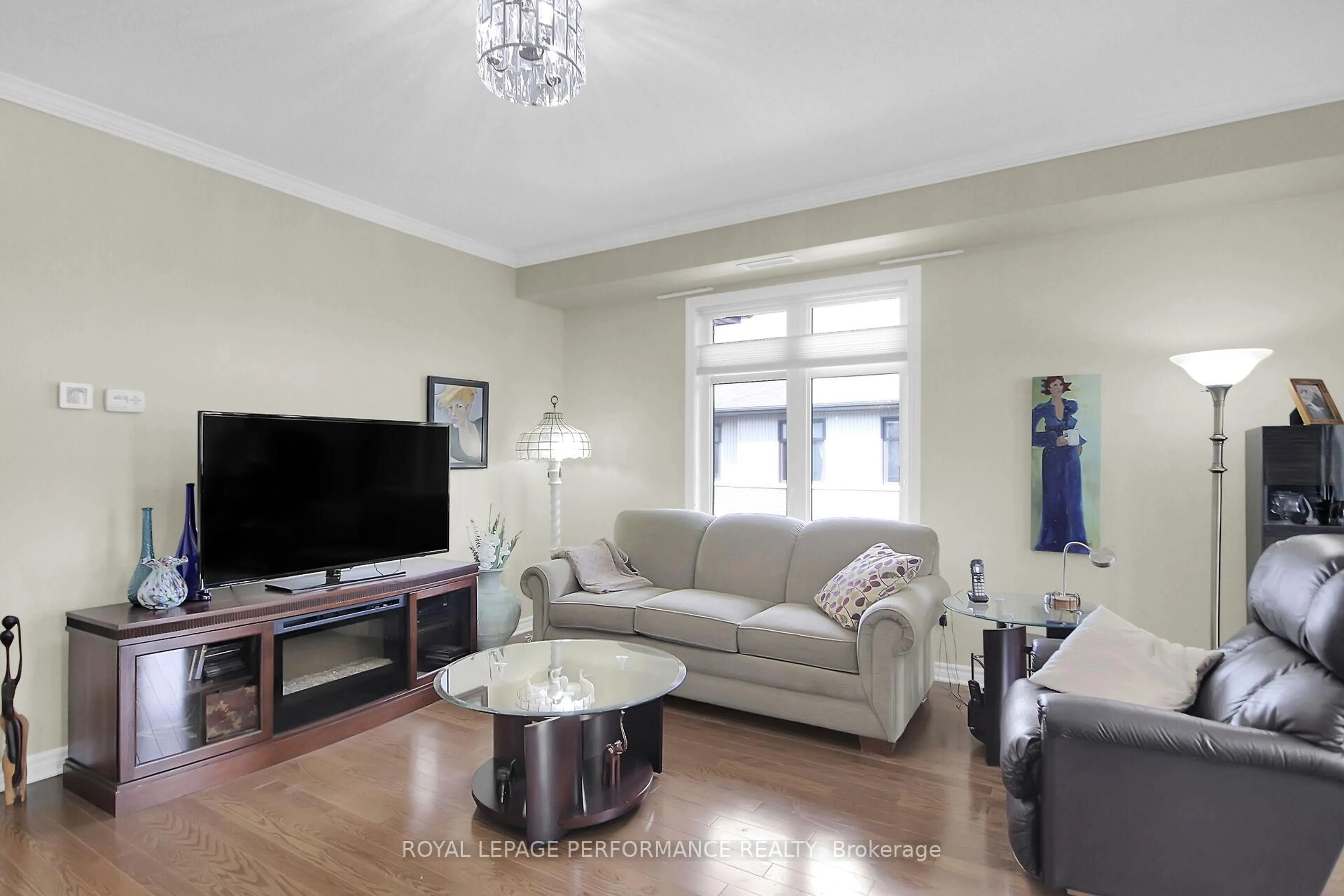 Living room with furniture, wood/laminate floor for 130 Guelph Private #302, Kanata Ontario K2T 0J1