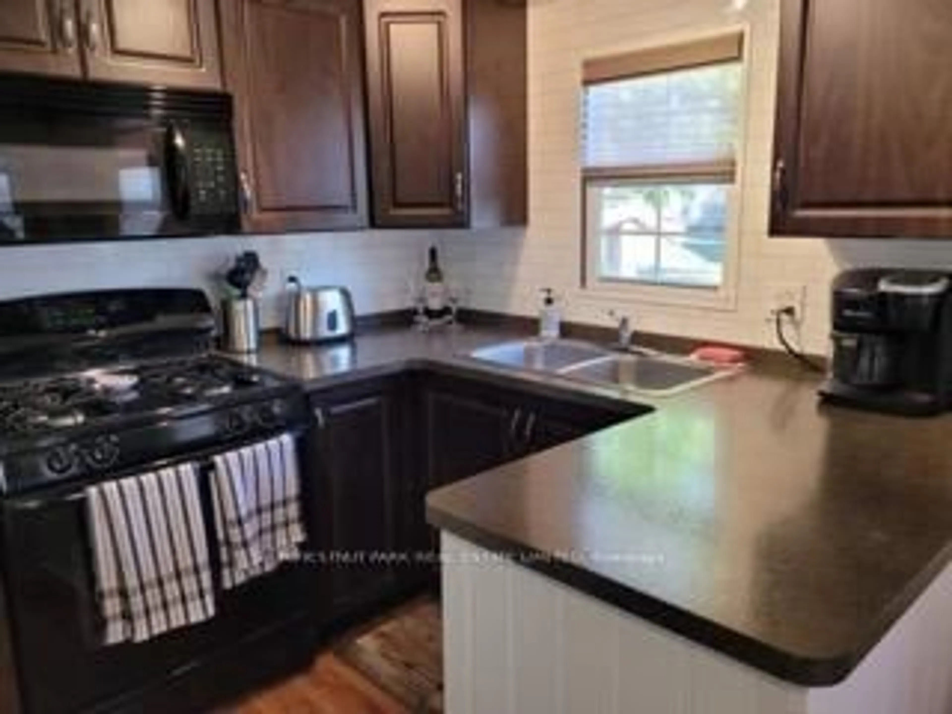 Open concept kitchen, unknown for 486 County Road 18 #CBL056, Prince Edward County Ontario K0K 1P0