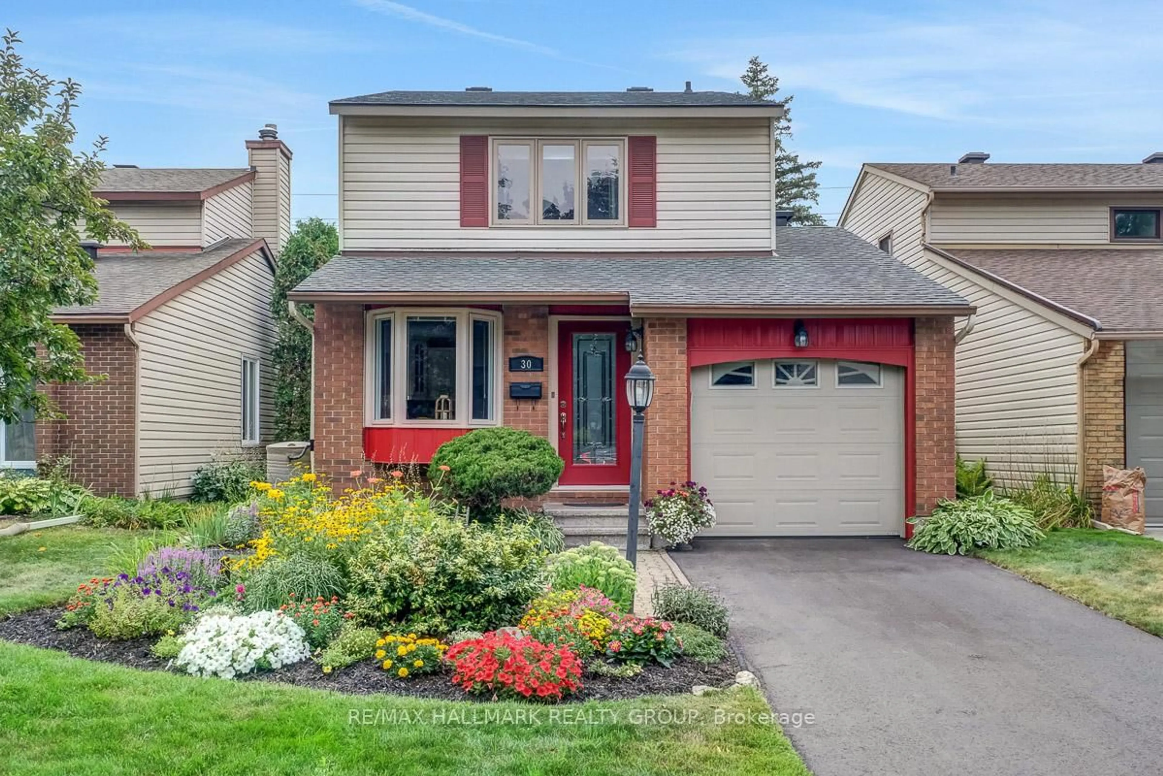 Home with brick exterior material, street for 30 Melville Dr, Ottawa Ontario K2J 2E9
