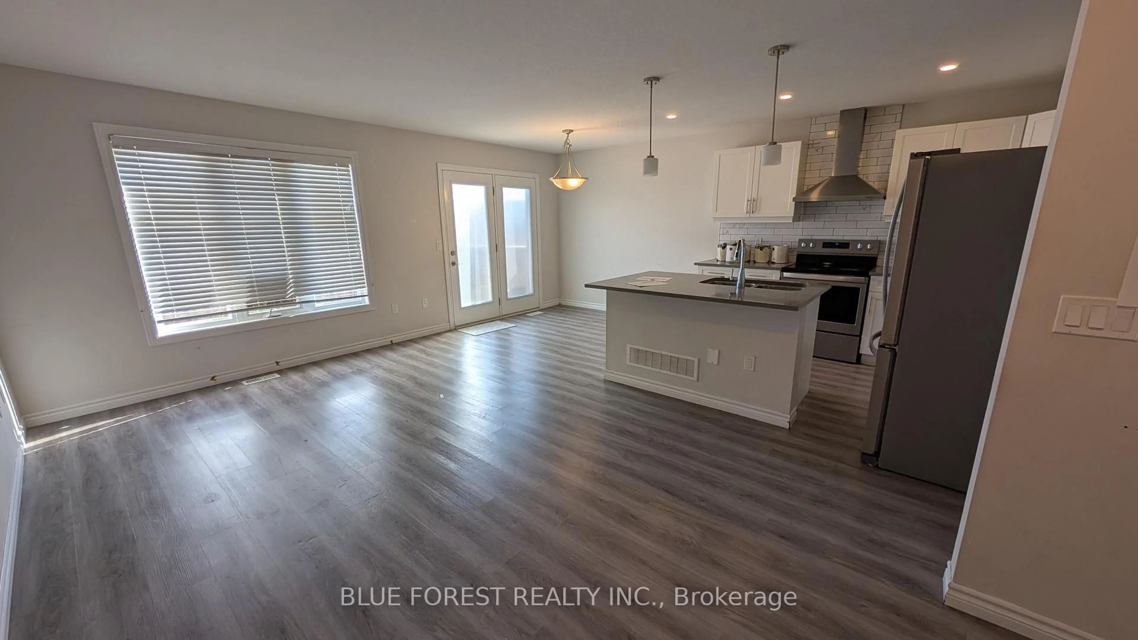 Open concept kitchen, wood/laminate floor for 3400 Castle Rock Pl #34, London South Ontario N6L 0E4