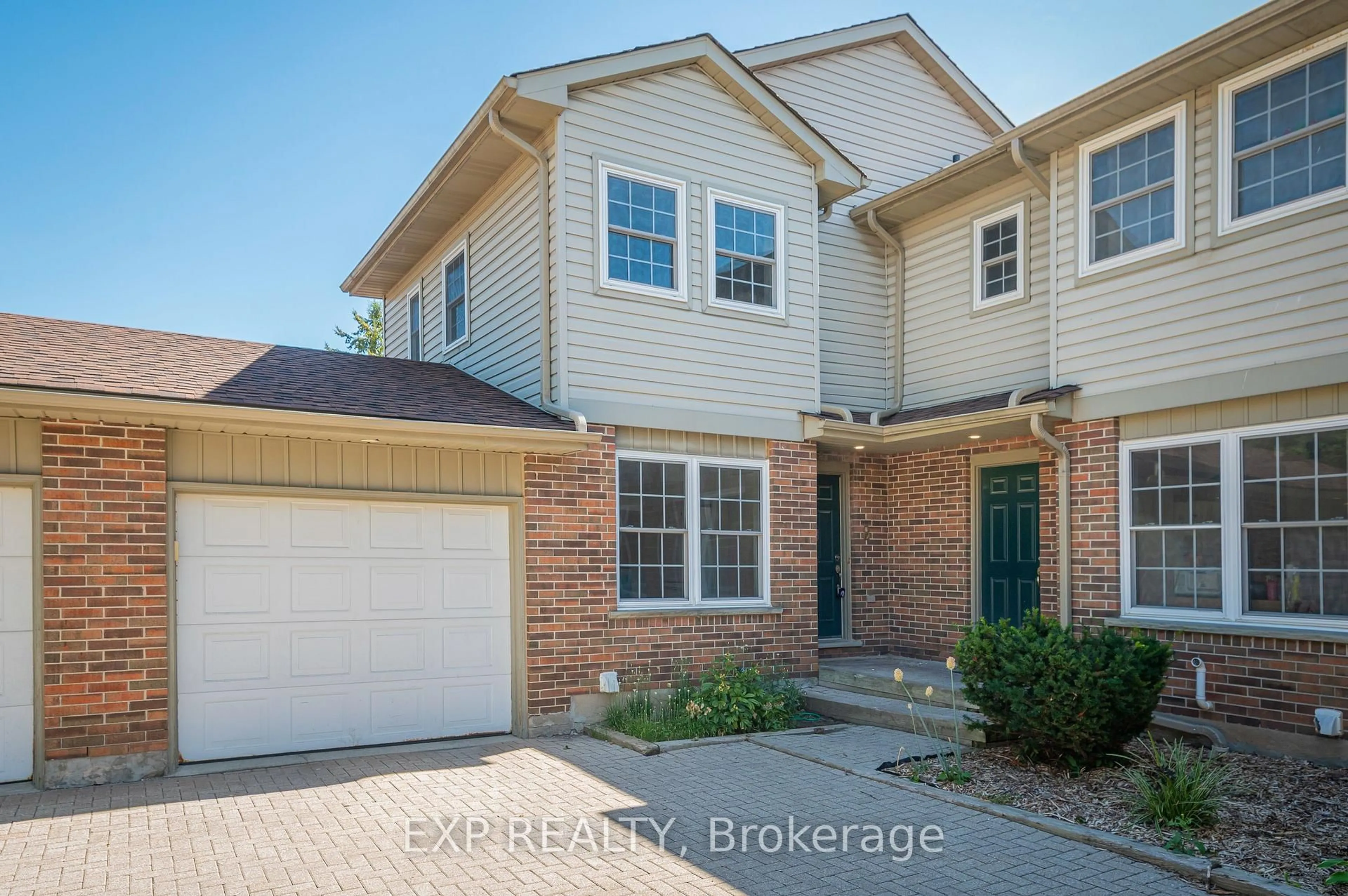 Home with brick exterior material, street for 250 Keats Way #8, Waterloo Ontario N2L 6J5