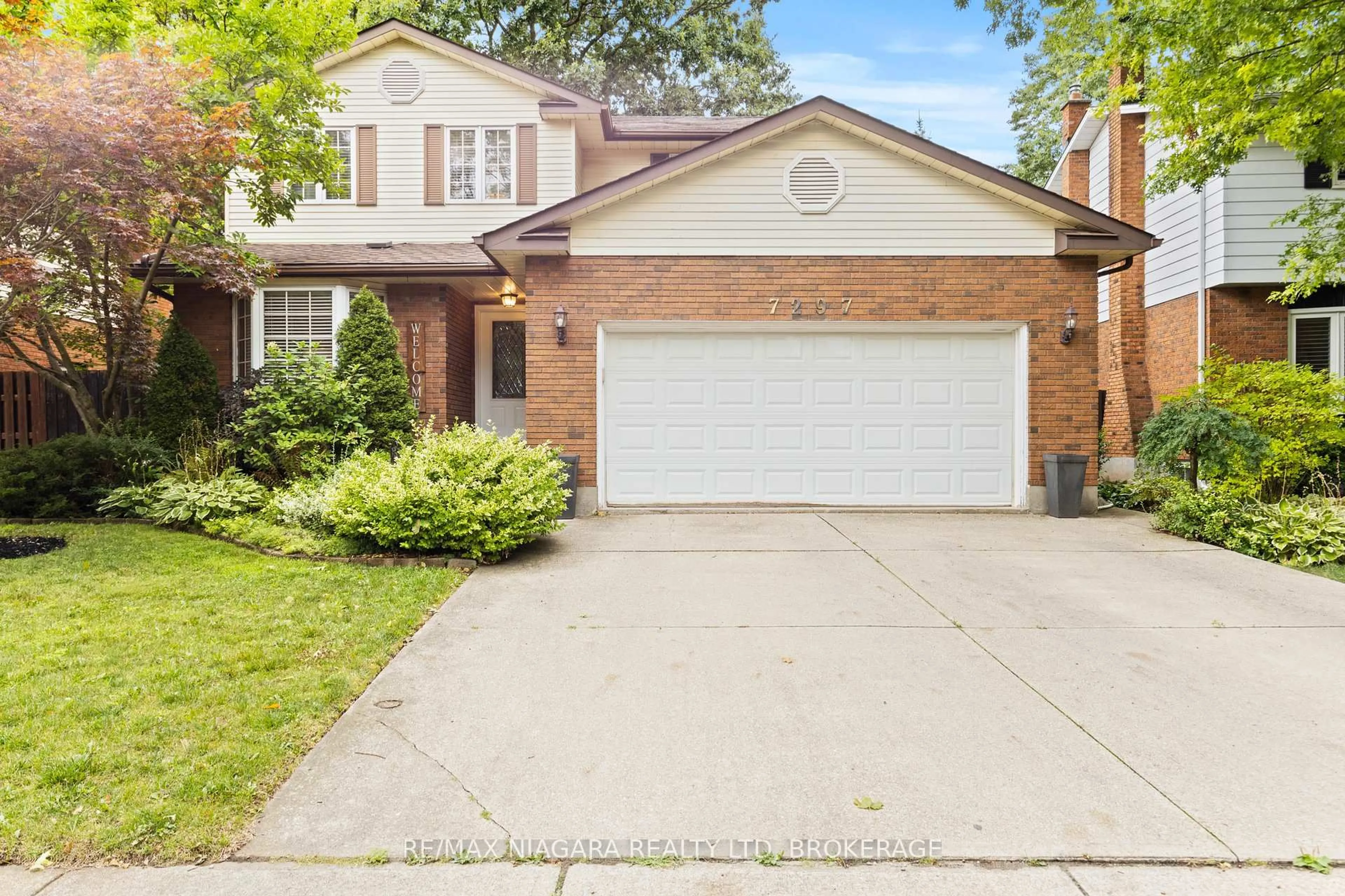 Home with brick exterior material, street for 7297 Green Boughs Rd, Niagara Falls Ontario L2J 3Y8