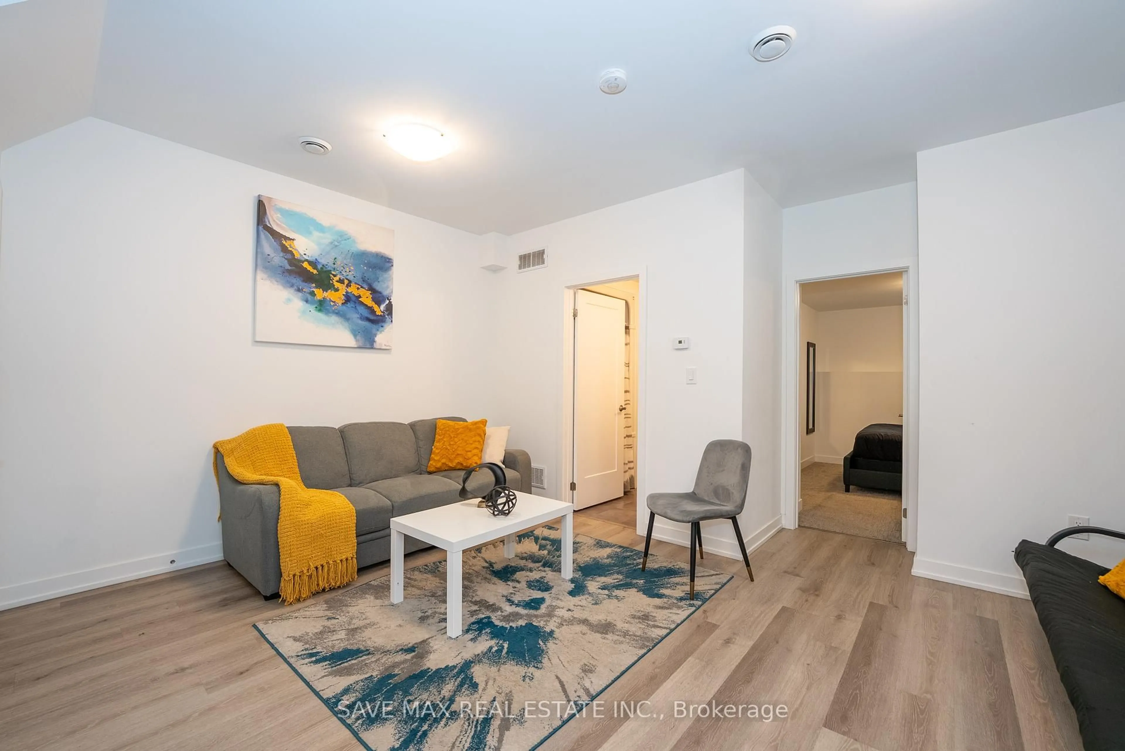 Living room with furniture, unknown for 781 Clare Ave #211, Welland Ontario L3C 0K1