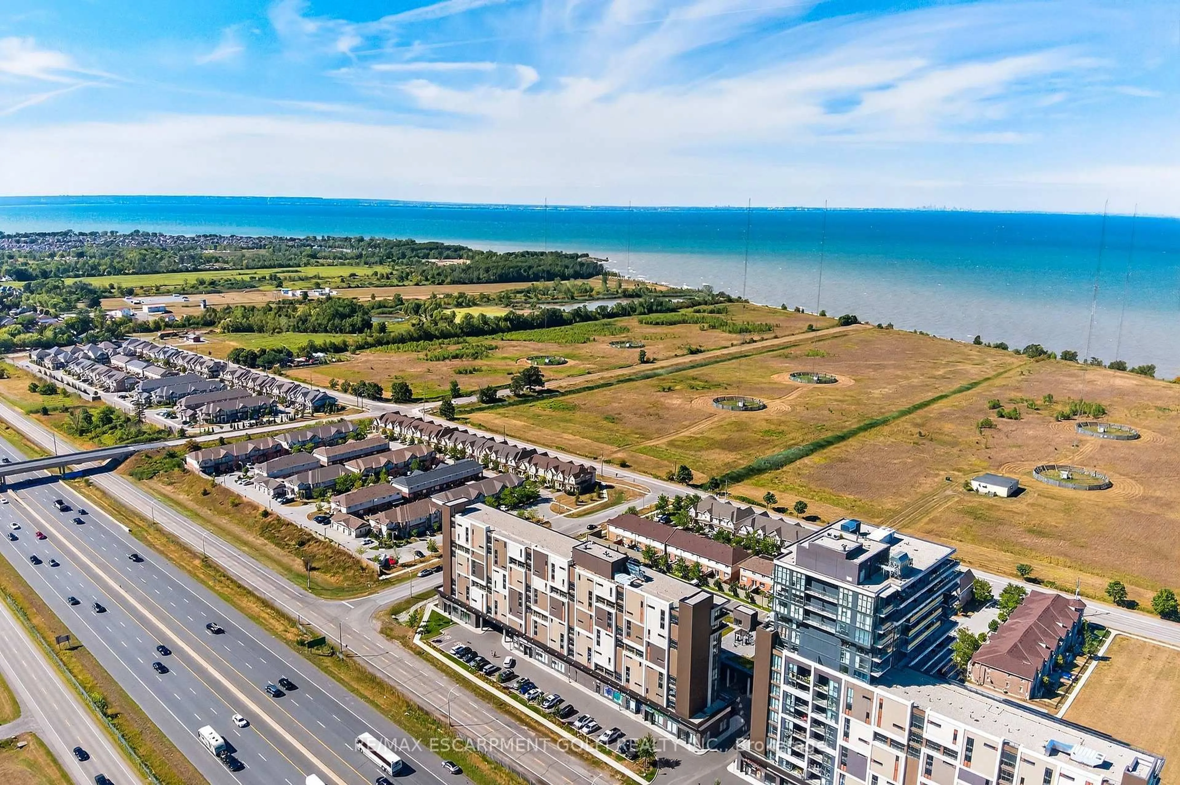A pic from outside/outdoor area/front of a property/back of a property/a pic from drone, water/lake/river/ocean view for 560 North Service Rd #505, Grimsby Ontario L3M 0G3