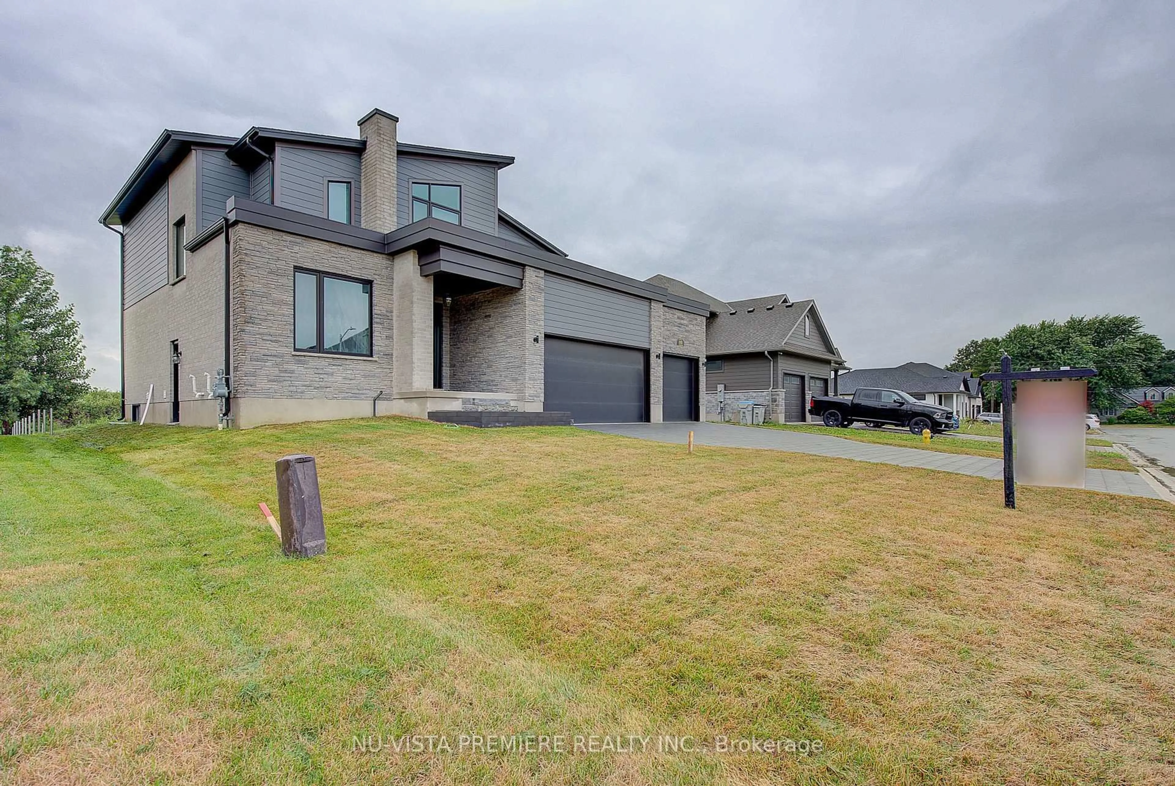 A pic from outside/outdoor area/front of a property/back of a property/a pic from drone, street for 153 McLeod St, North Middlesex Ontario N0M 2K0