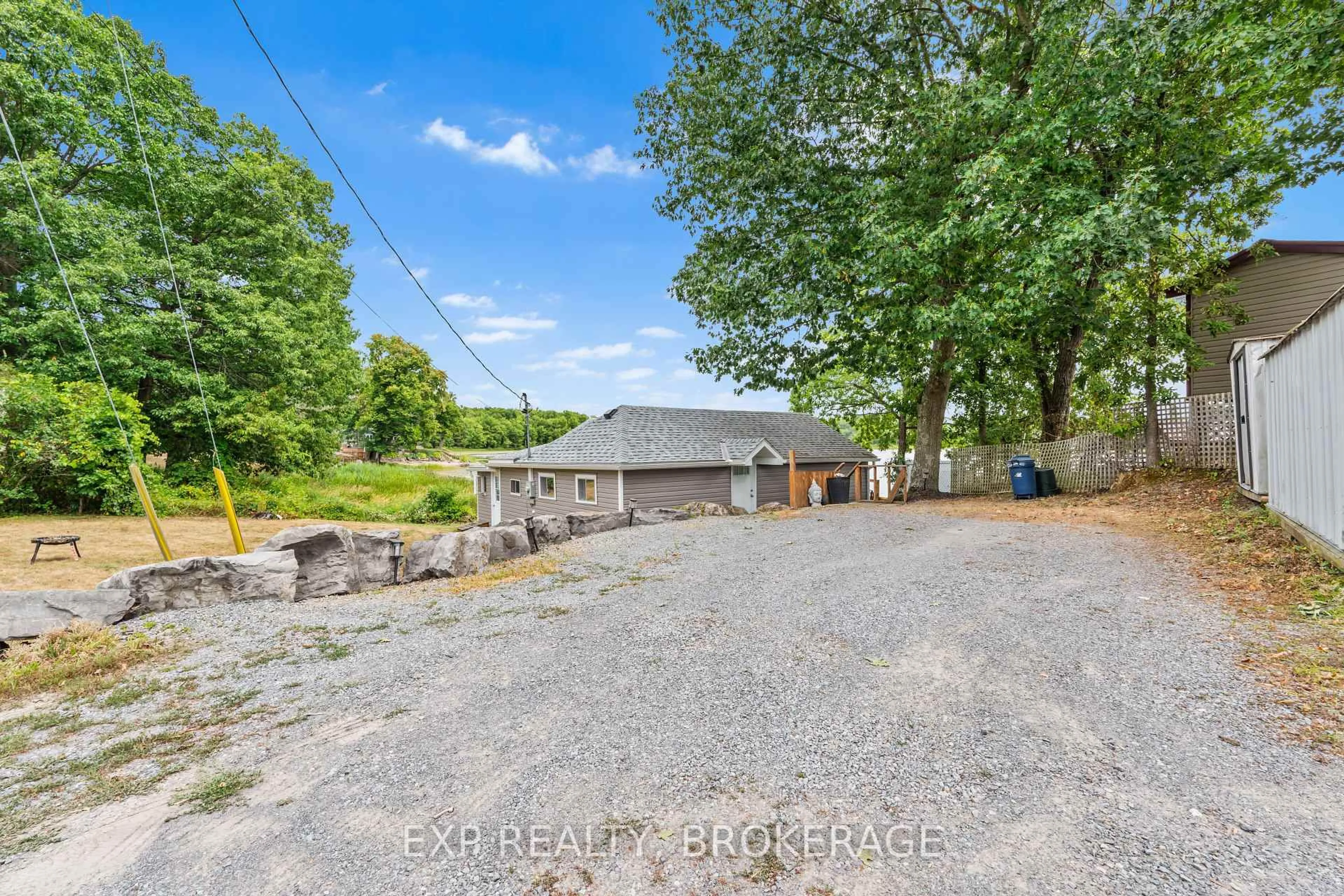 A pic from outside/outdoor area/front of a property/back of a property/a pic from drone, water/lake/river/ocean view for 1035 LLOYD Lane, Verona Ontario K0H 2W0
