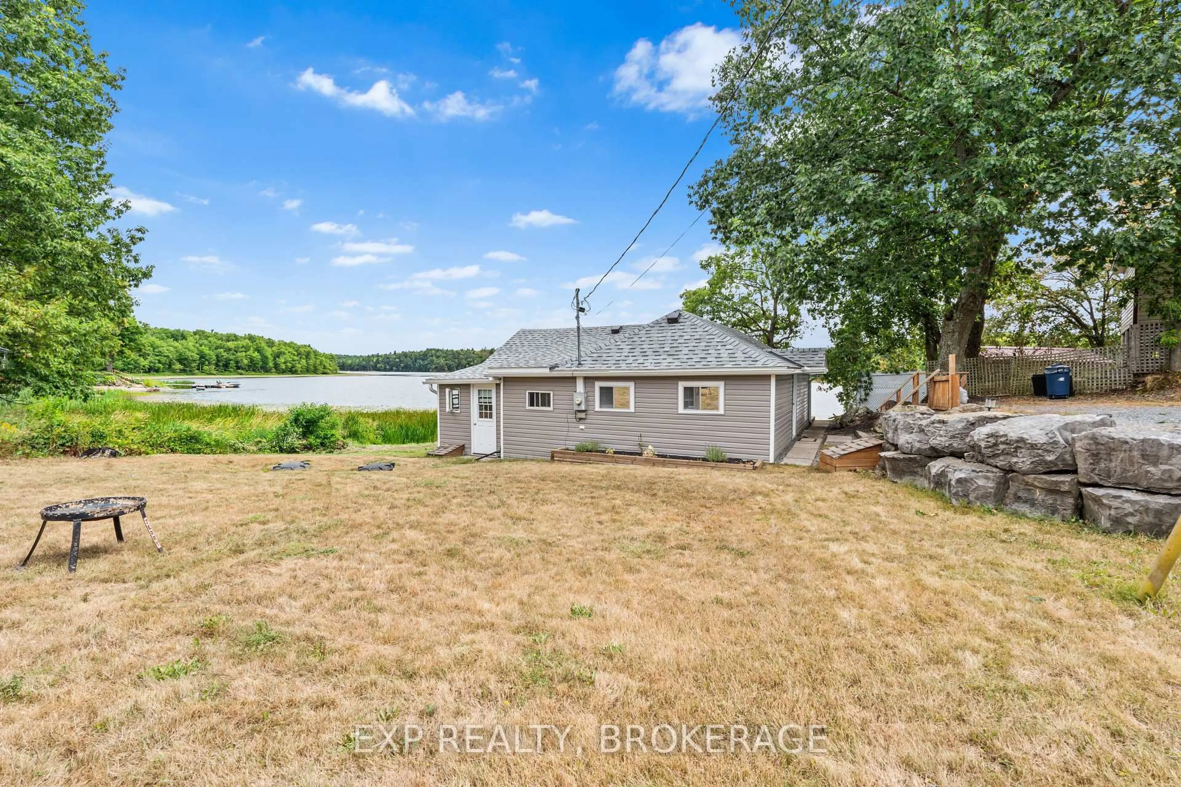 A pic from outside/outdoor area/front of a property/back of a property/a pic from drone, water/lake/river/ocean view for 1035 LLOYD Lane, Verona Ontario K0H 2W0