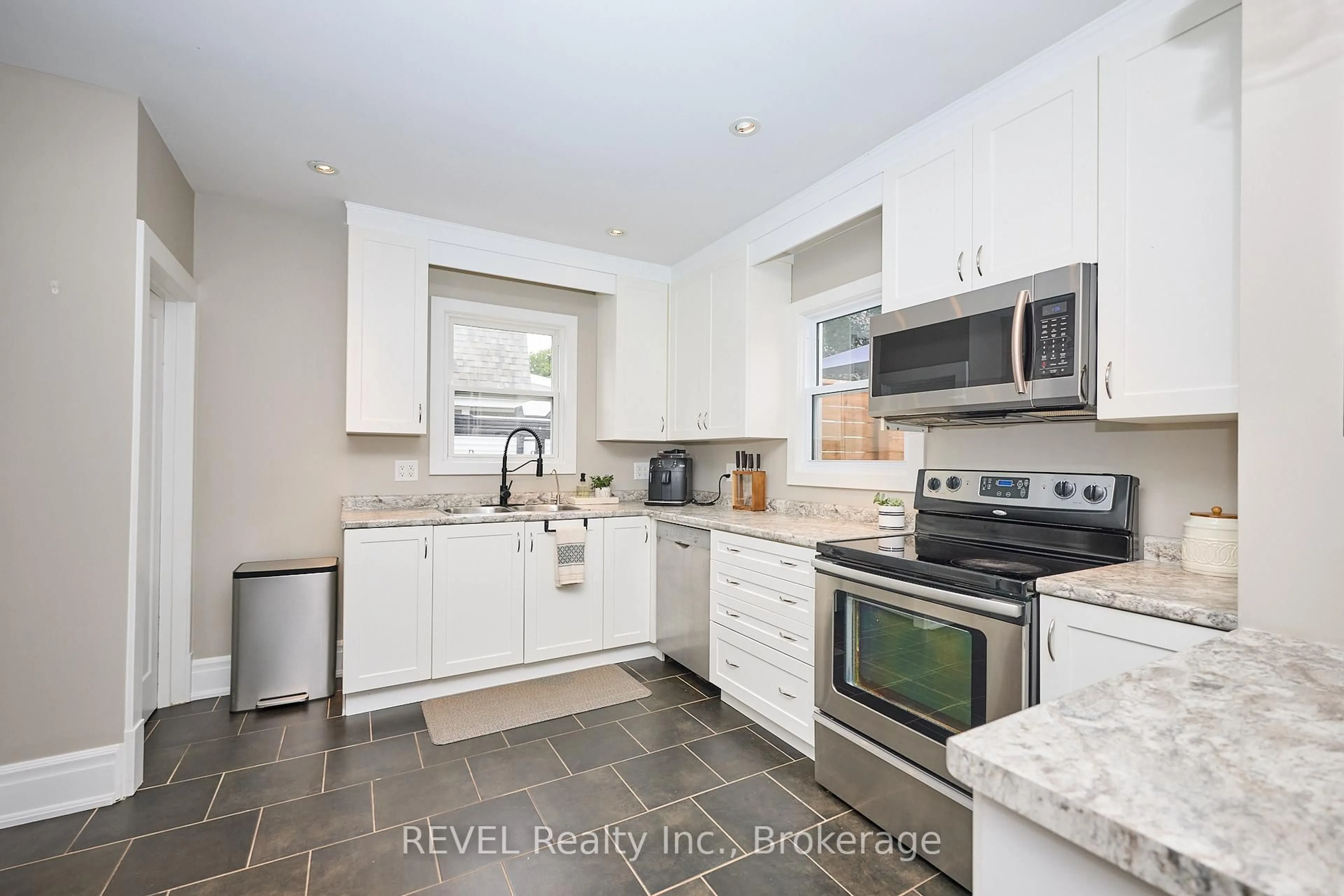 Open concept kitchen, ceramic/tile floor for 5849 Symmes St, Niagara Falls Ontario L2G 2G4