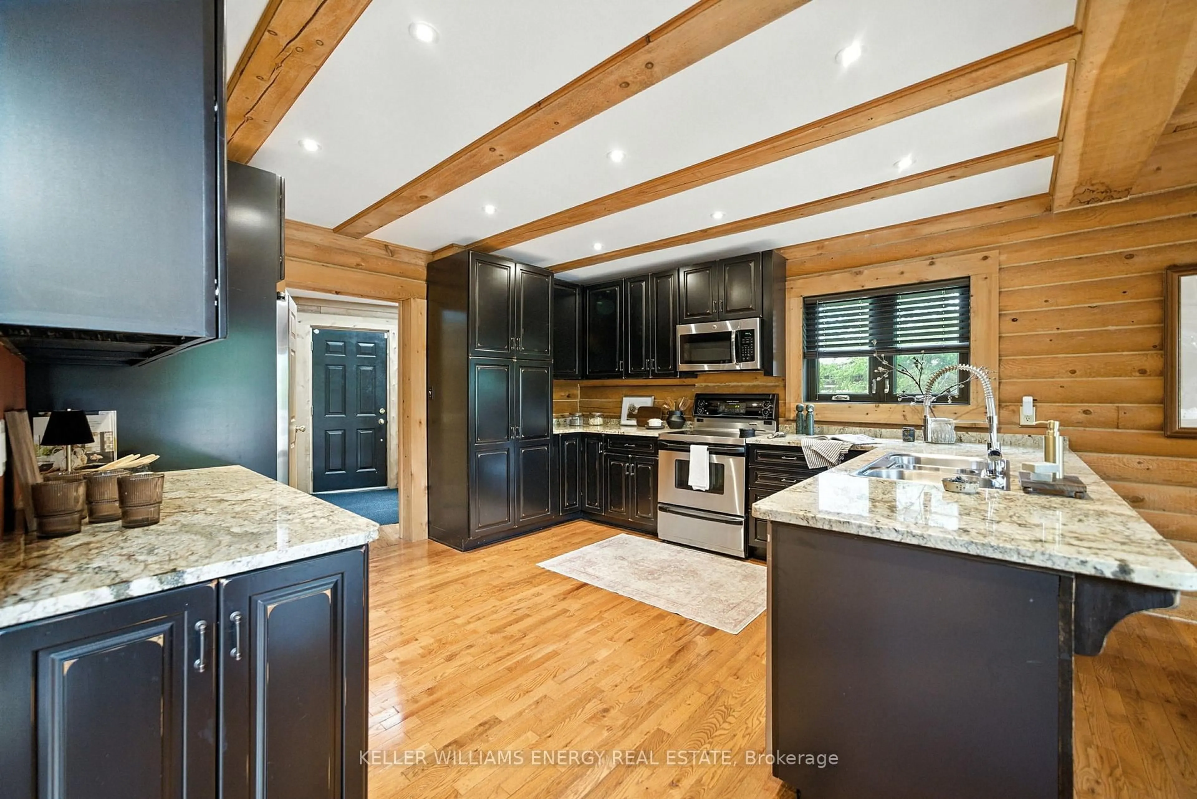 Open concept kitchen, wood/laminate floor for 27 Mill St, Kawartha Lakes Ontario K0M 1A0