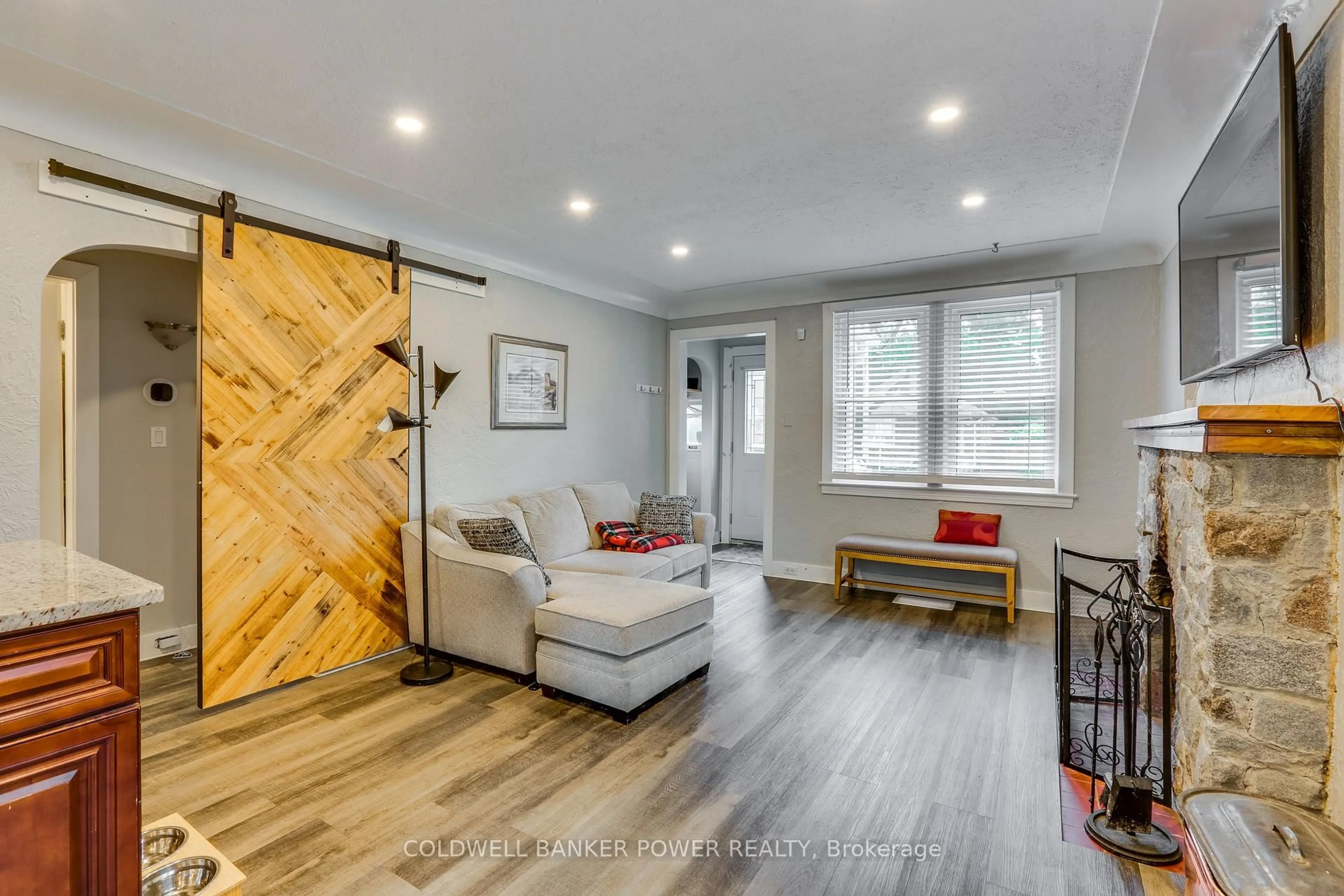 Living room with furniture, wood/laminate floor for 64 Bond St, London South Ontario N6C 1W3