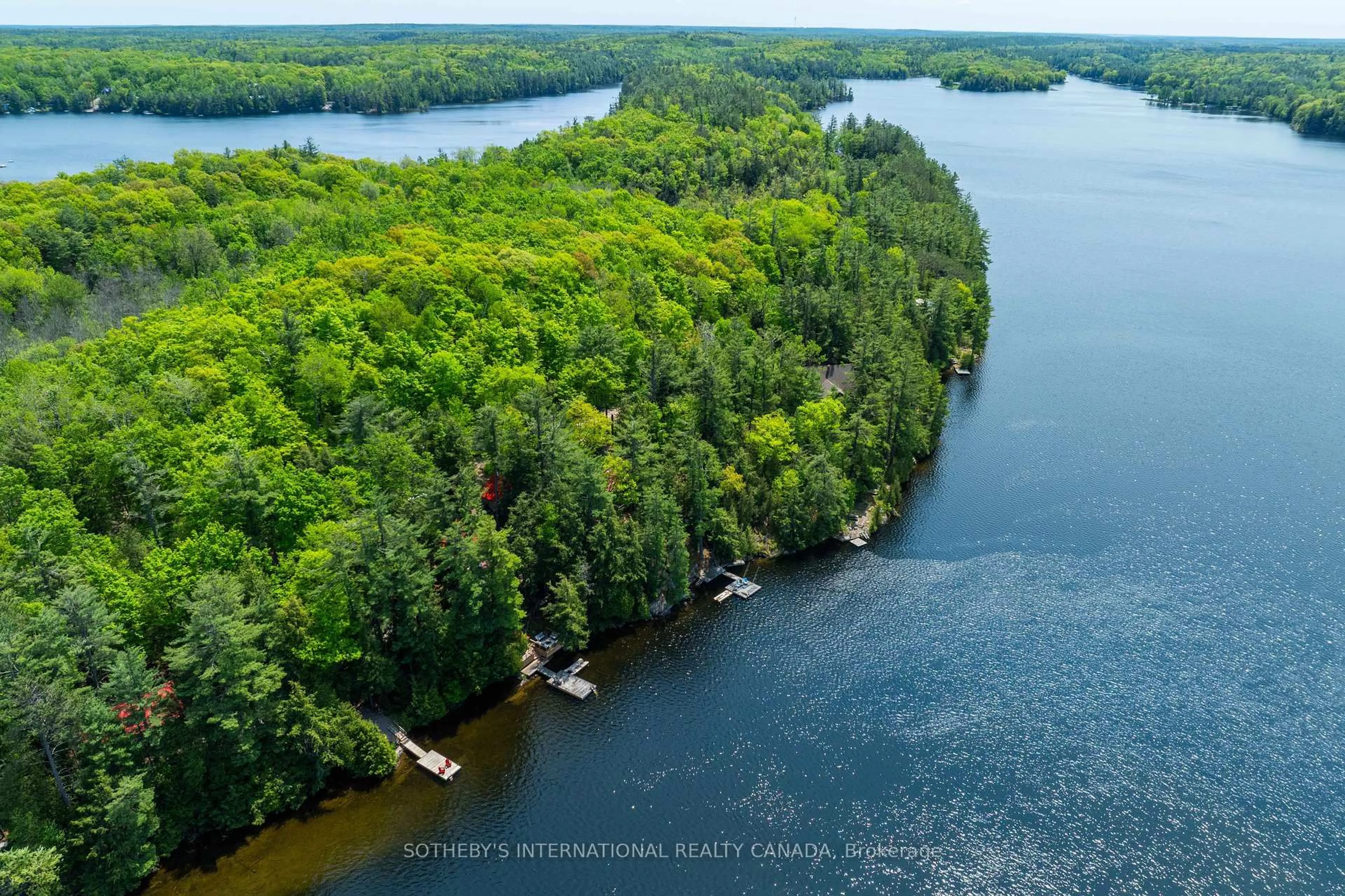 A pic from outside/outdoor area/front of a property/back of a property/a pic from drone, water/lake/river/ocean view for 1050 Cobble Rose Lane, Minden Hills Ontario K0M 2L1