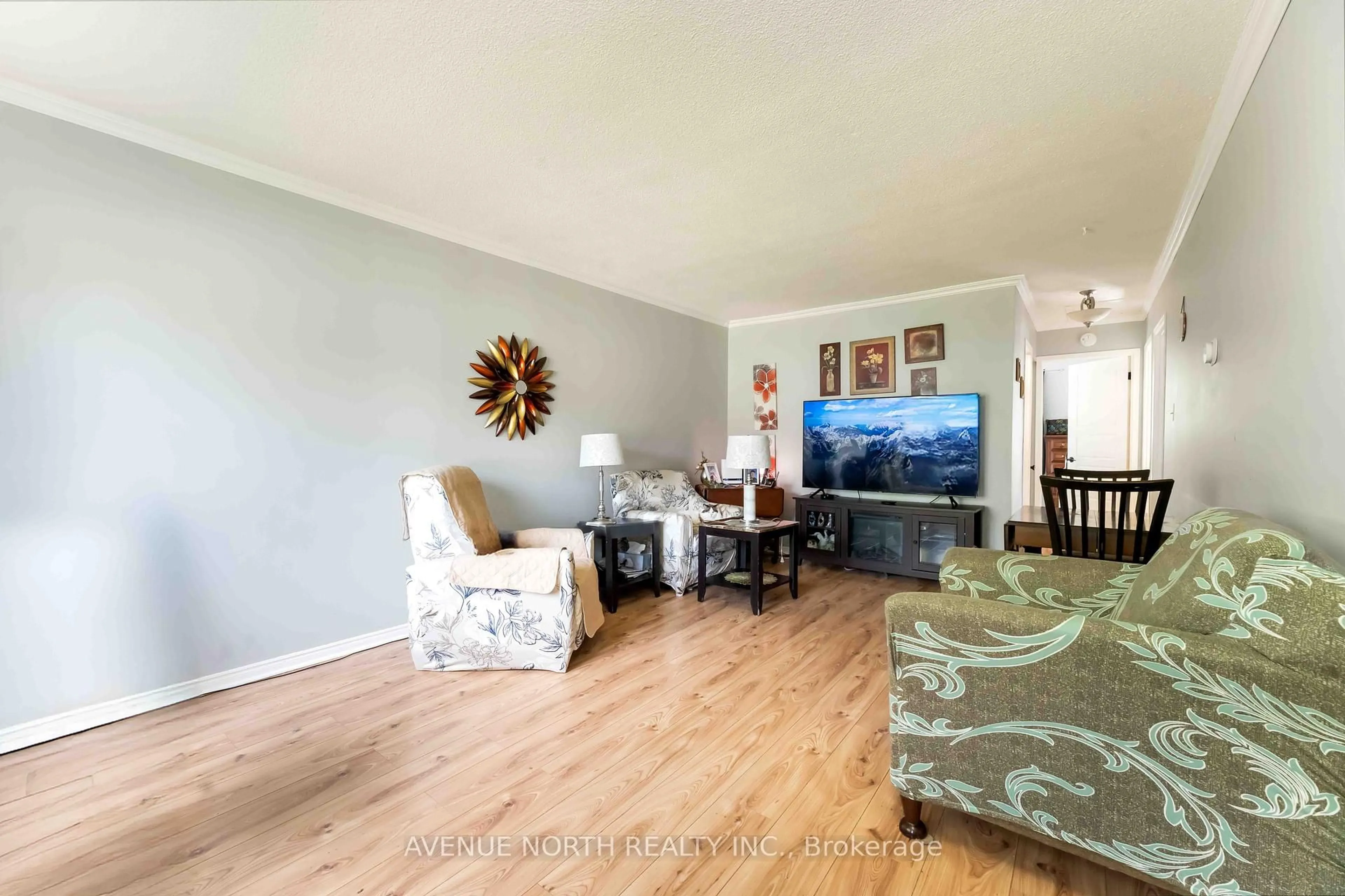 Living room with furniture, wood/laminate floor for 39 Ballantrae Way, Ottawa Ontario K2L 1N3