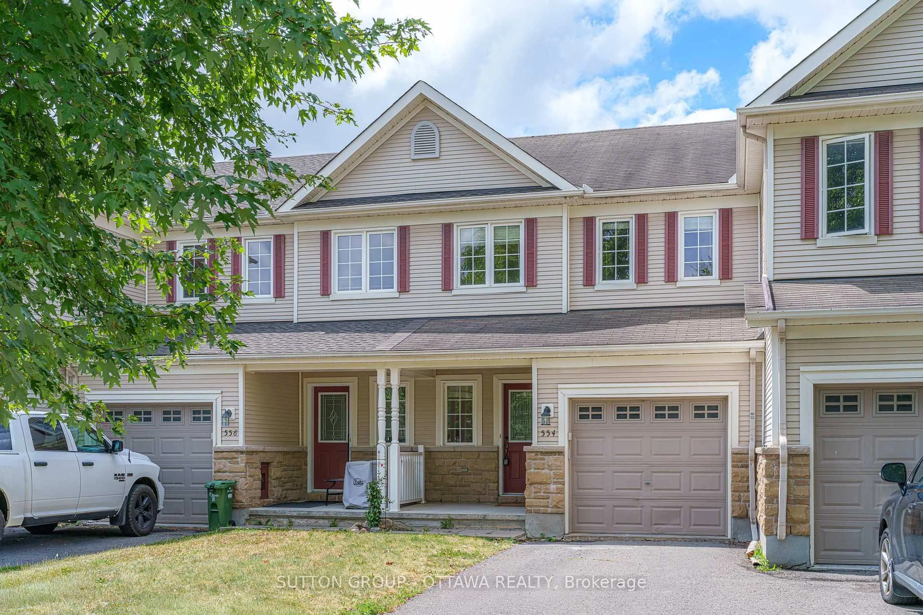 Home with vinyl exterior material, street for 554 Ashbourne Cres, Ottawa Ontario K2J 0P6