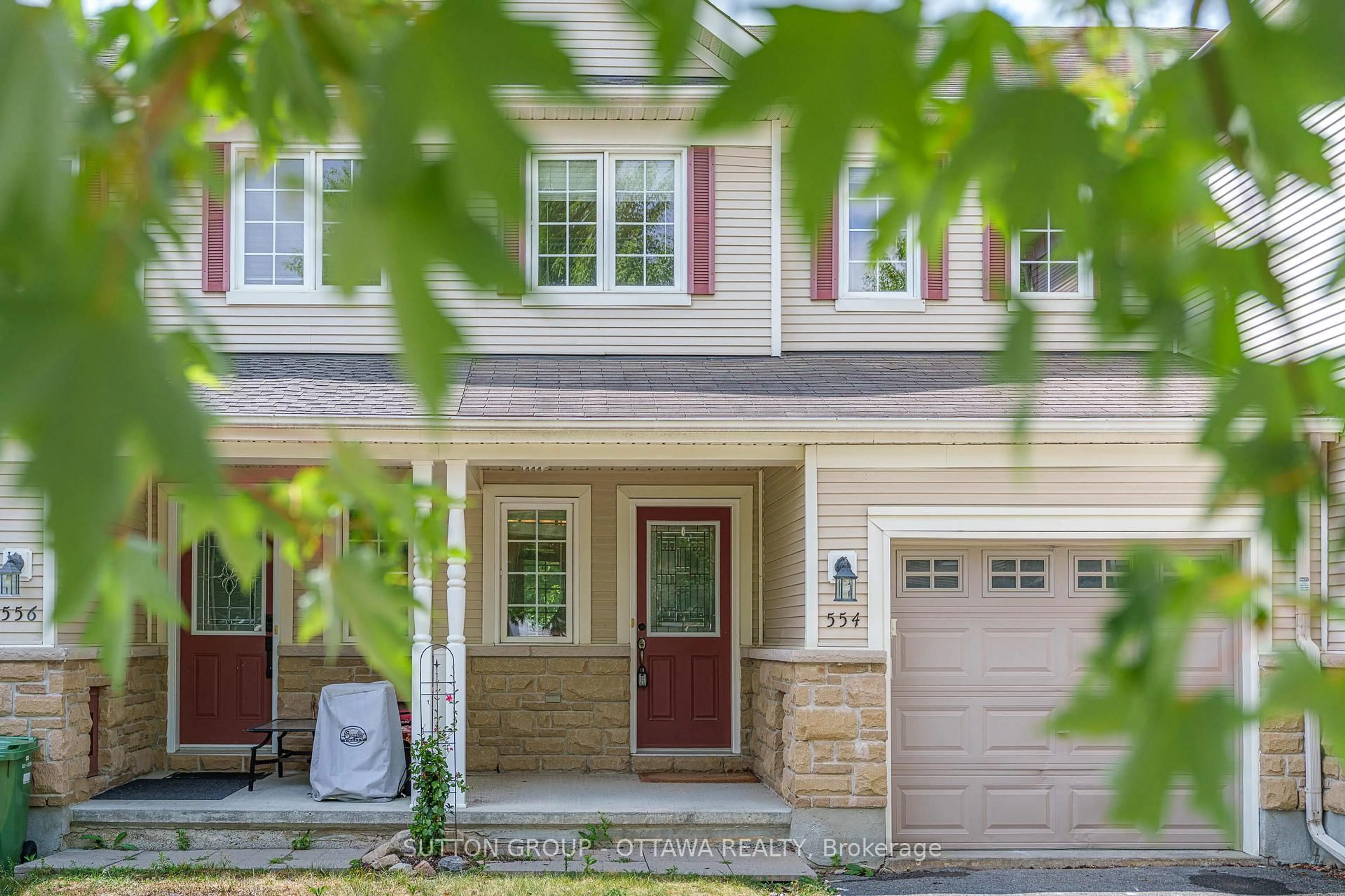 Home with vinyl exterior material, street for 554 Ashbourne Cres, Ottawa Ontario K2J 0P6