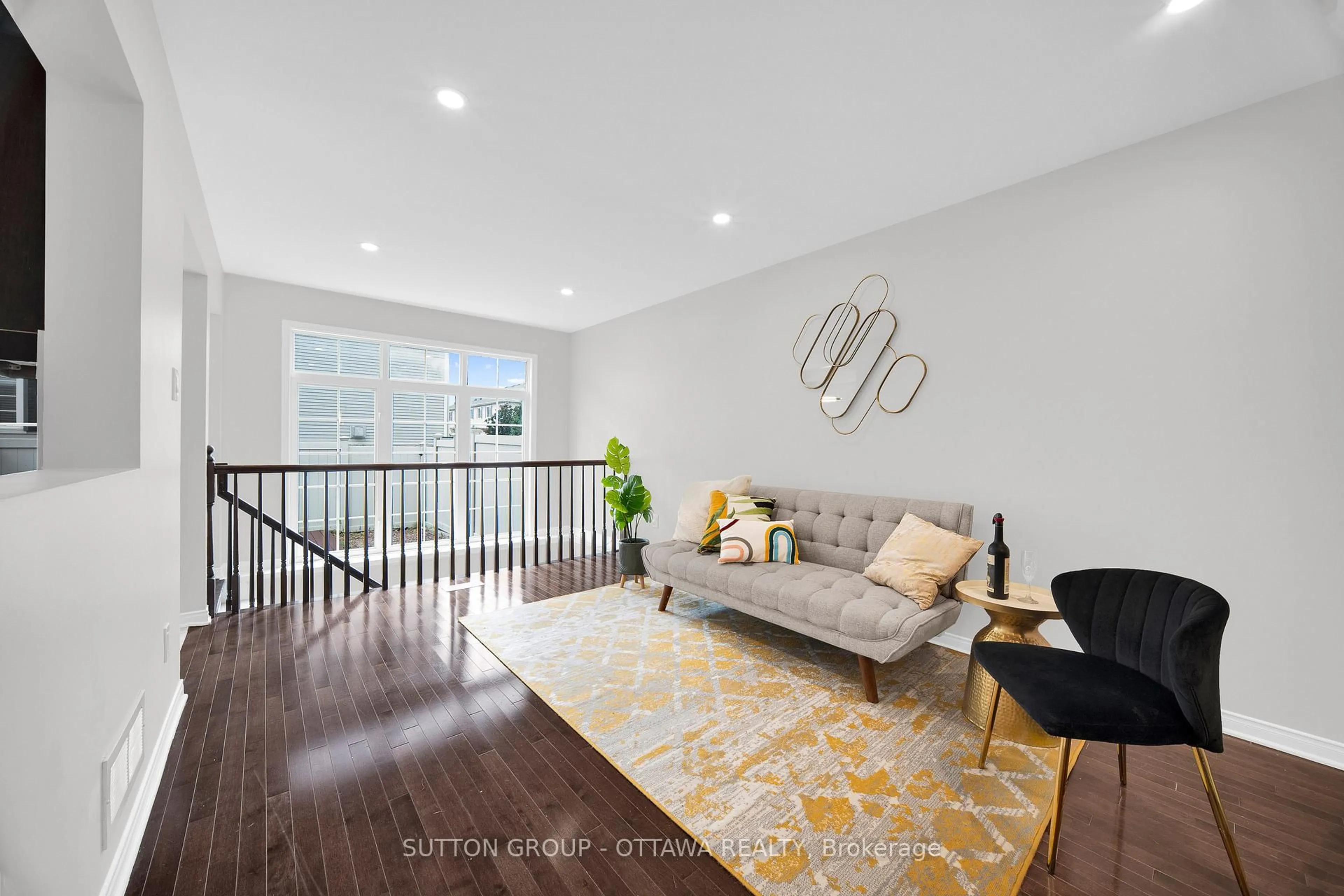 Living room with furniture, wood/laminate floor for 554 Ashbourne Cres, Ottawa Ontario K2J 0P6