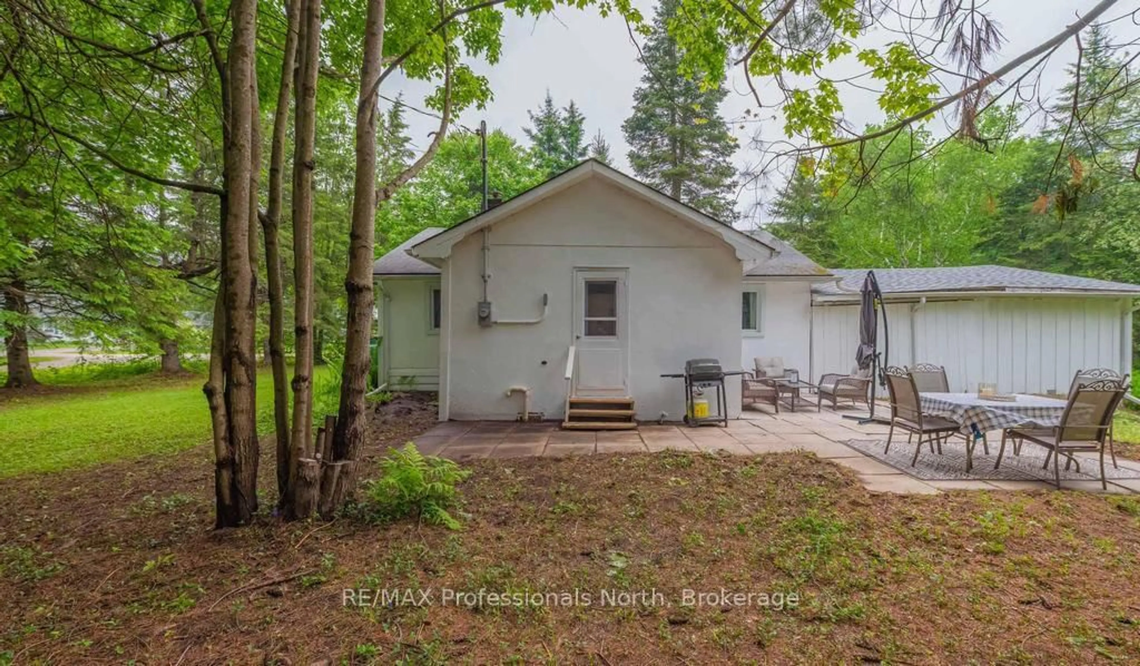 A pic from outside/outdoor area/front of a property/back of a property/a pic from drone, forest/trees view for 7 Stouffer St, Minden Hills Ontario K0M 2K0