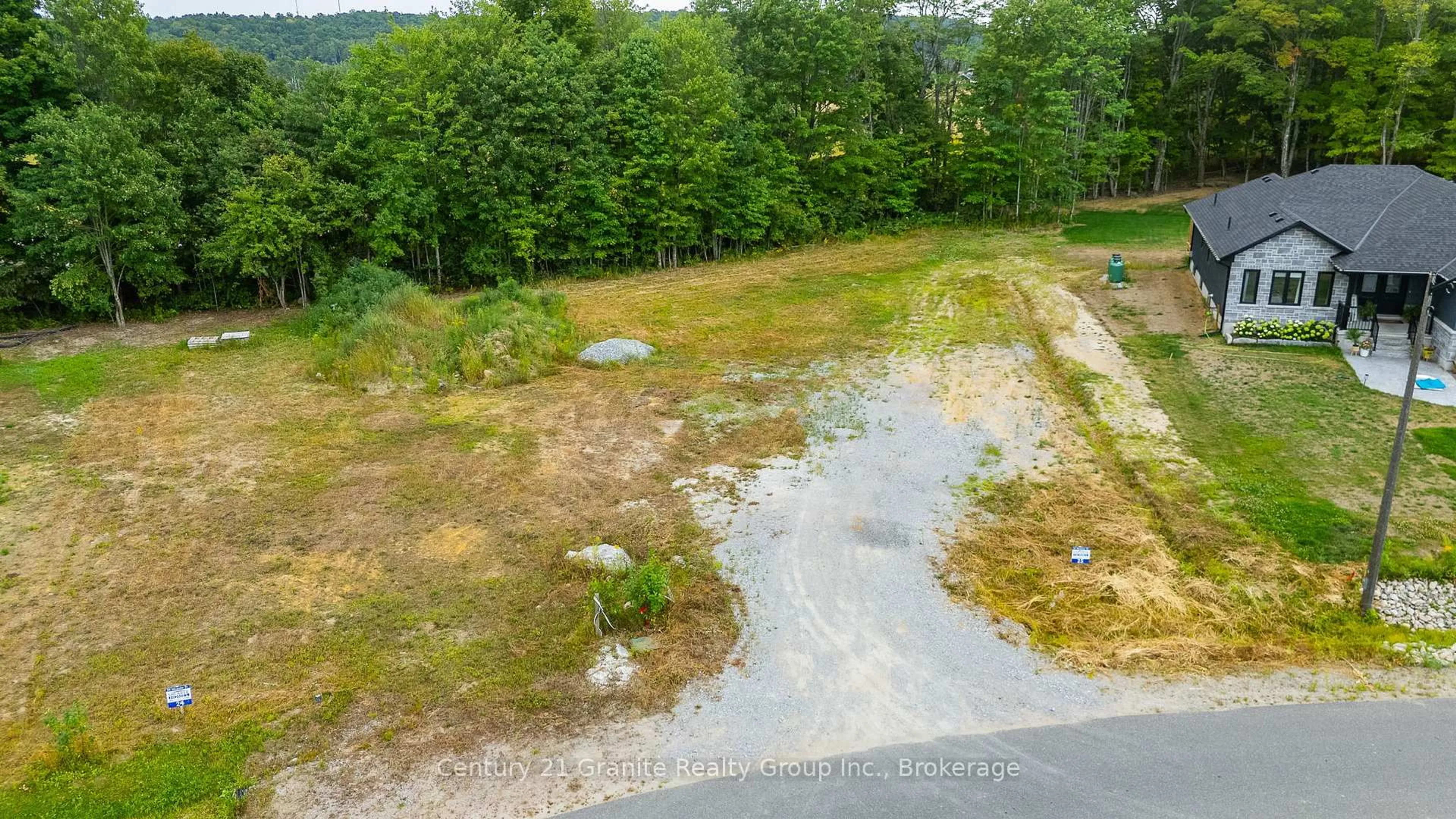 A pic from outside/outdoor area/front of a property/back of a property/a pic from drone, forest/trees view for 52 Windover Dr, Minden Hills Ontario K0M 2K0