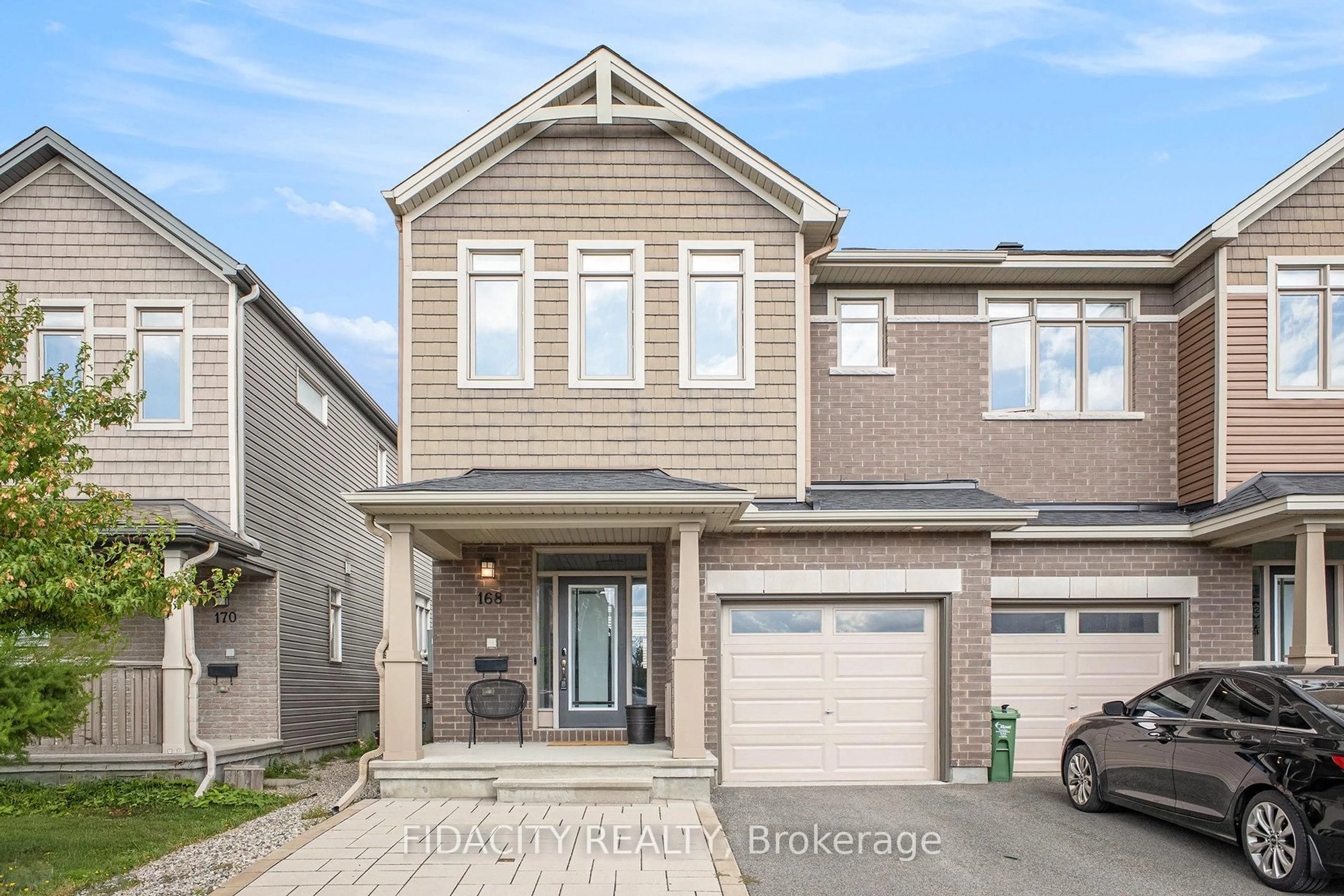 Home with brick exterior material, street for 168 Overberg Way, Ottawa Ontario K2S 0V8