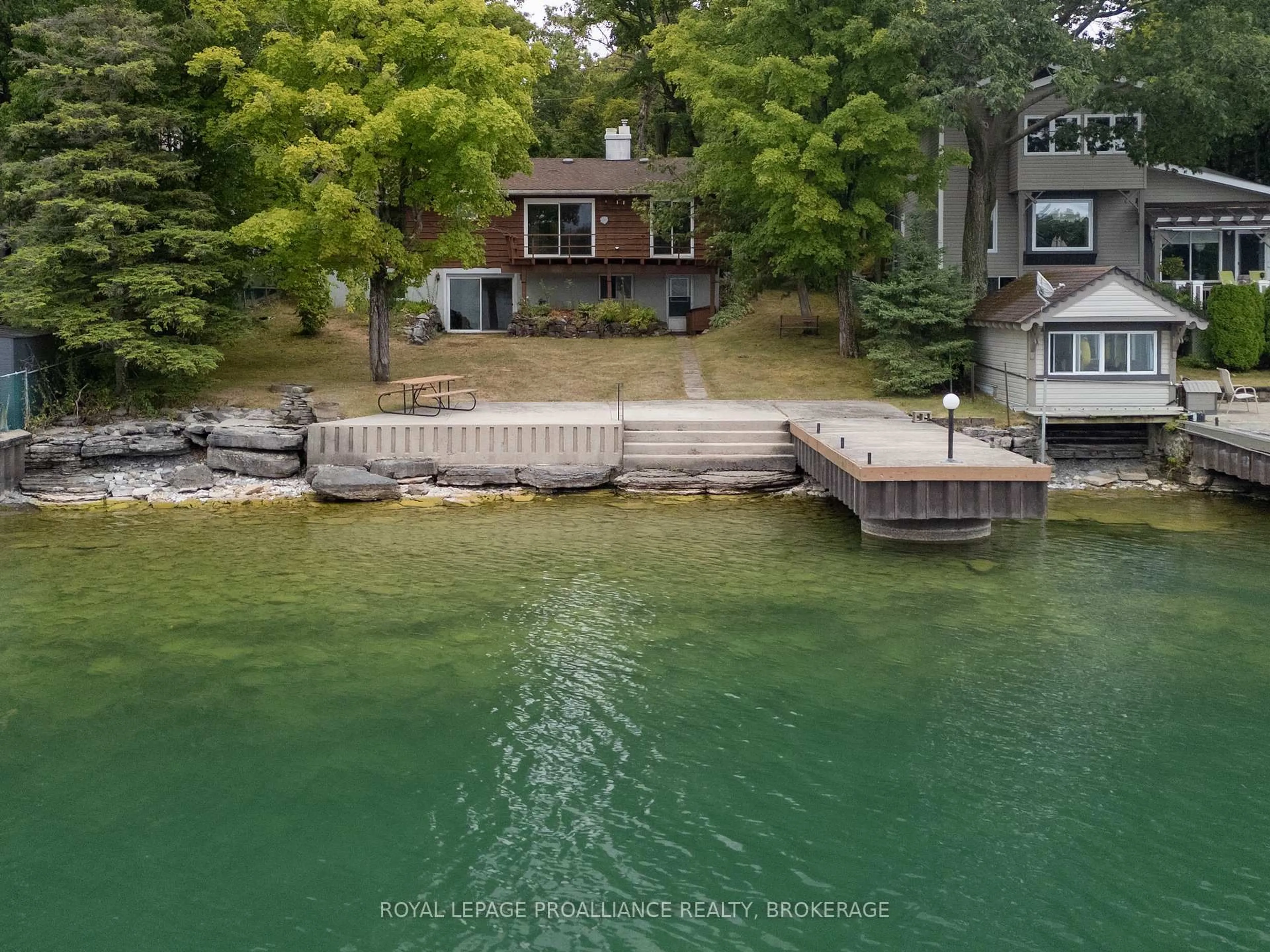 A pic from outside/outdoor area/front of a property/back of a property/a pic from drone, water/lake/river/ocean view for 314 Nicholson Point Rd, Bath Ontario K0H 1G0