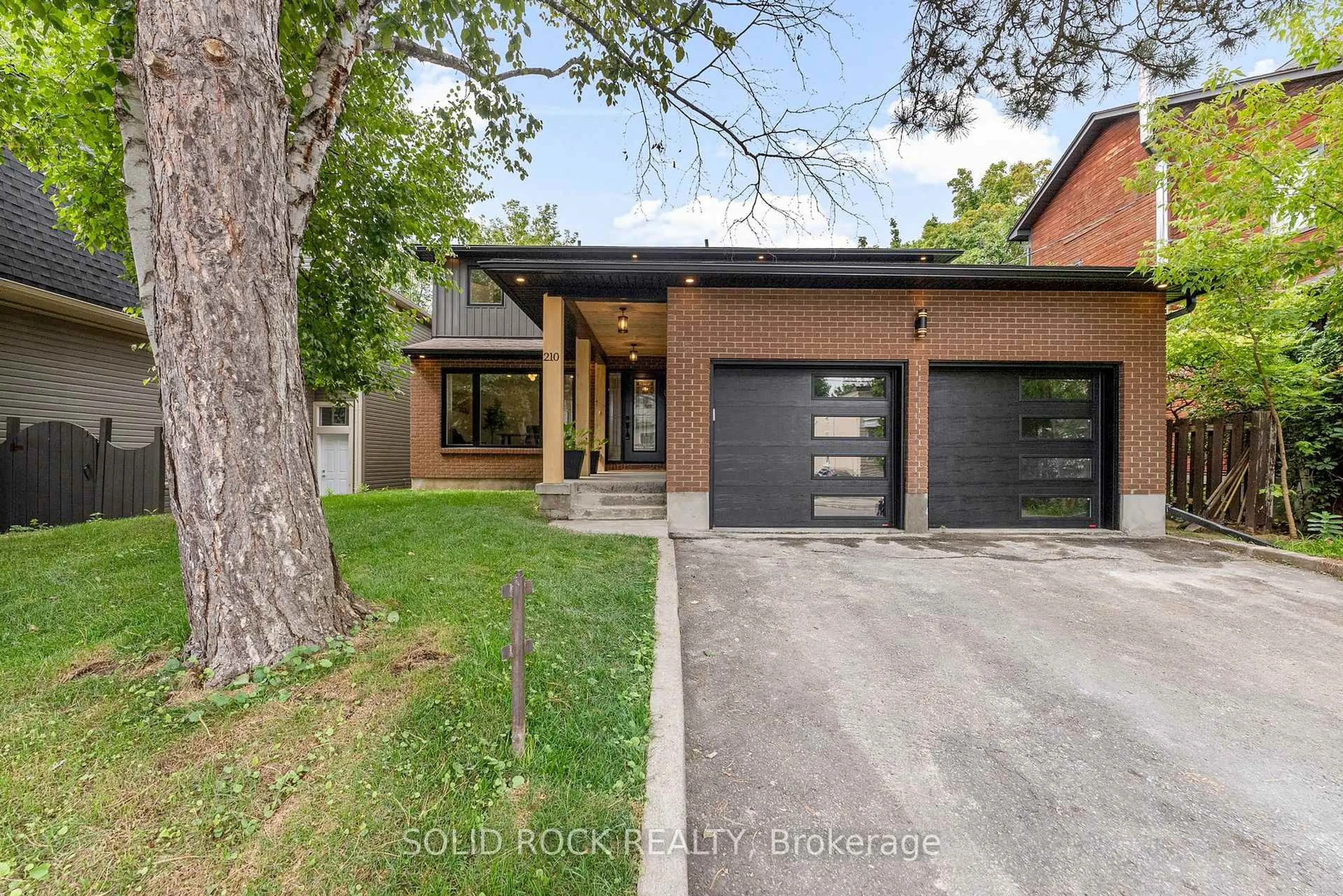 Home with brick exterior material, street for 210 Carleton Ave, Ottawa Ontario K1Y 0J3