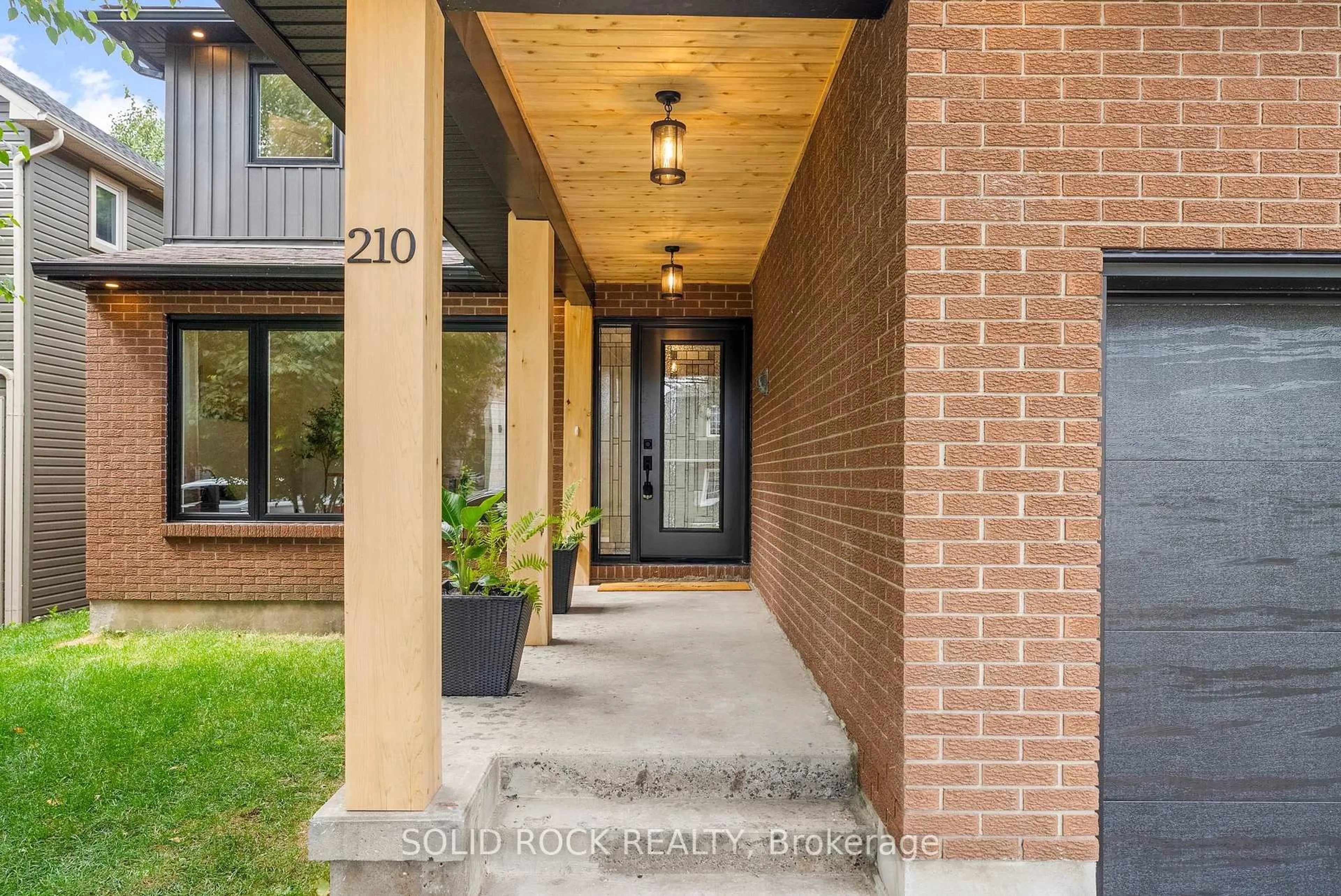 Home with brick exterior material, street for 210 Carleton Ave, Ottawa Ontario K1Y 0J3
