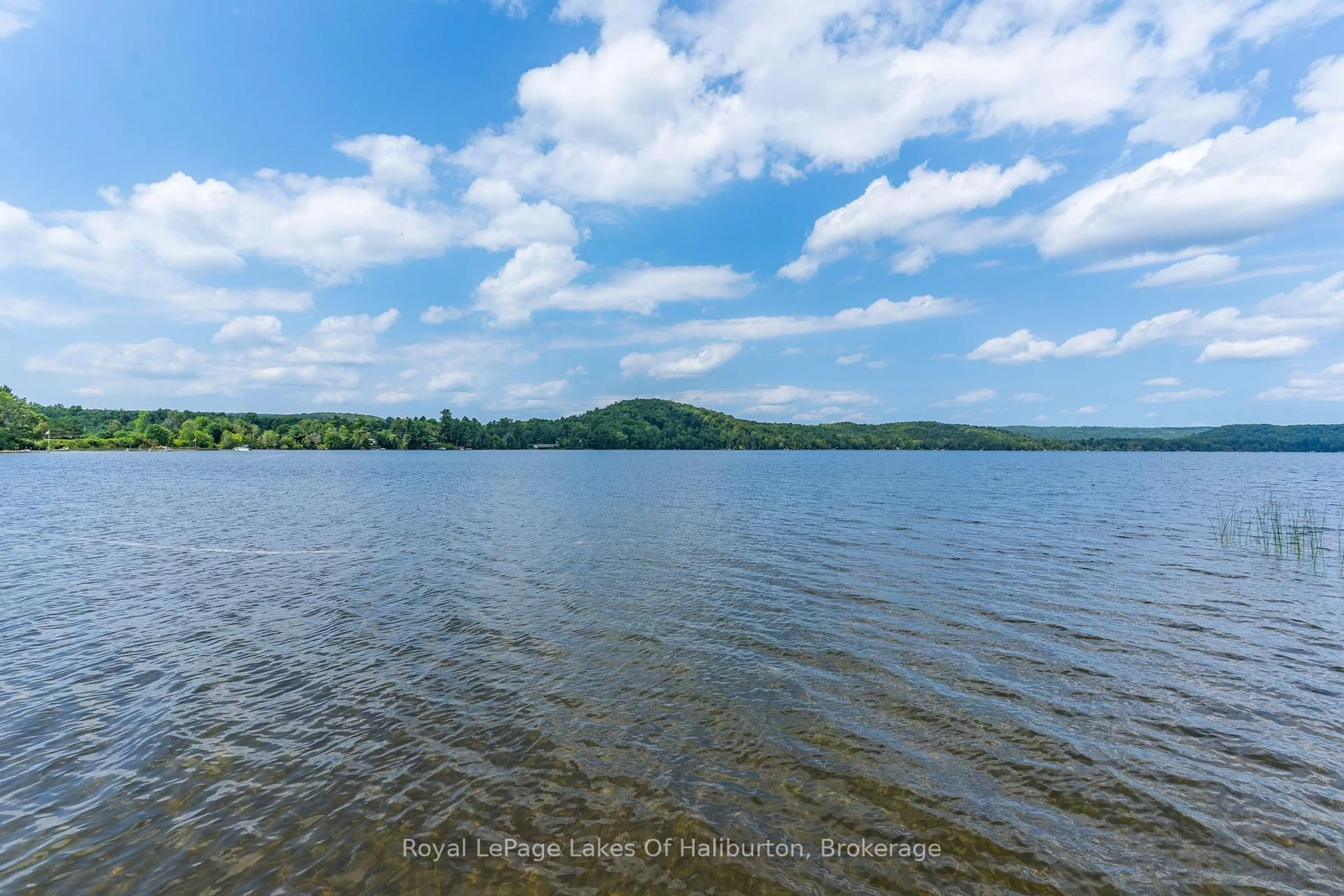 A pic from outside/outdoor area/front of a property/back of a property/a pic from drone, water/lake/river/ocean view for 1049 Ninatigo Lane, Algonquin Highlands Ontario K0M 1S0