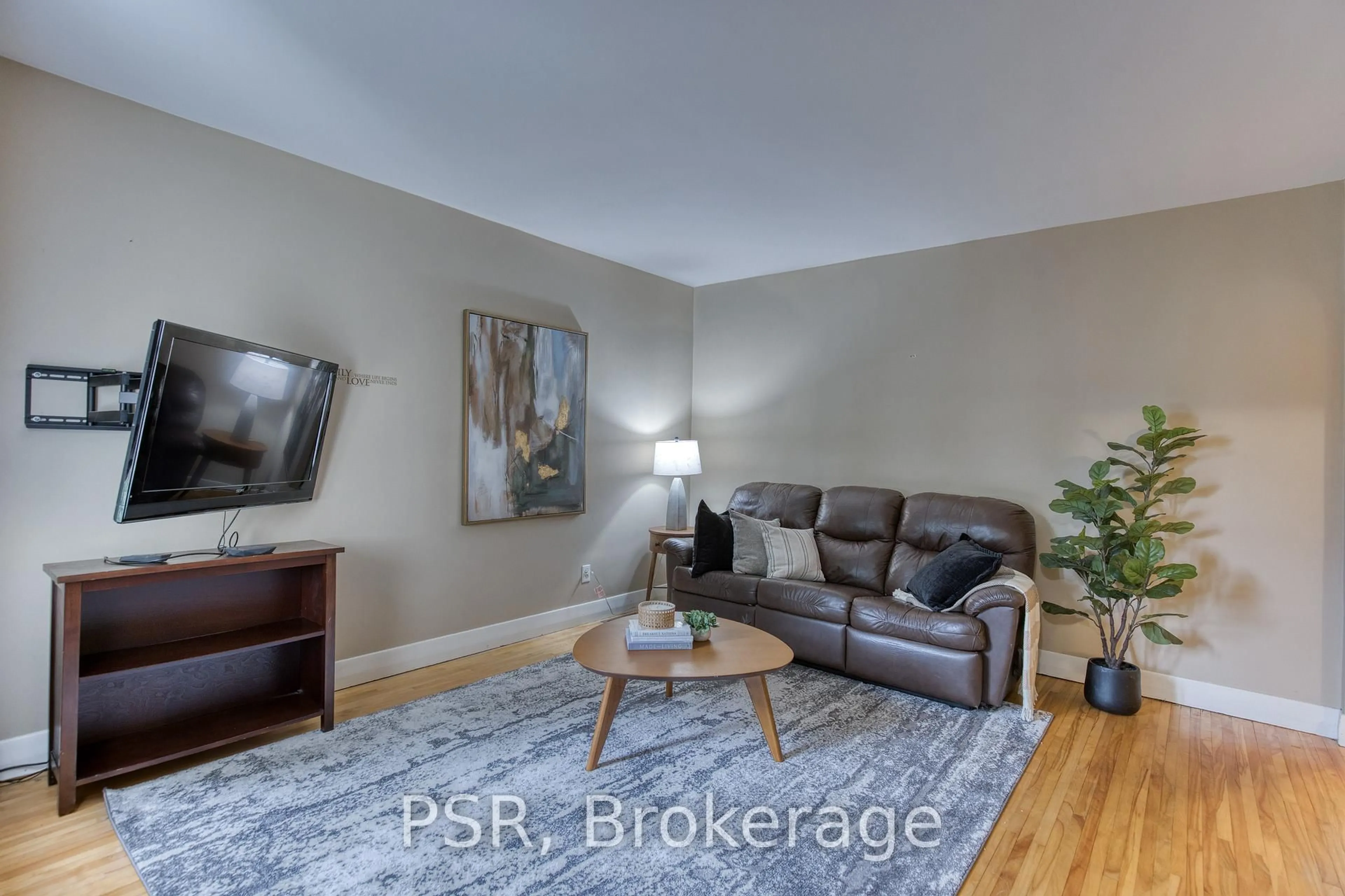 Living room with furniture, wood/laminate floor for 94 North Dr, Kitchener Ontario N2M 1K8