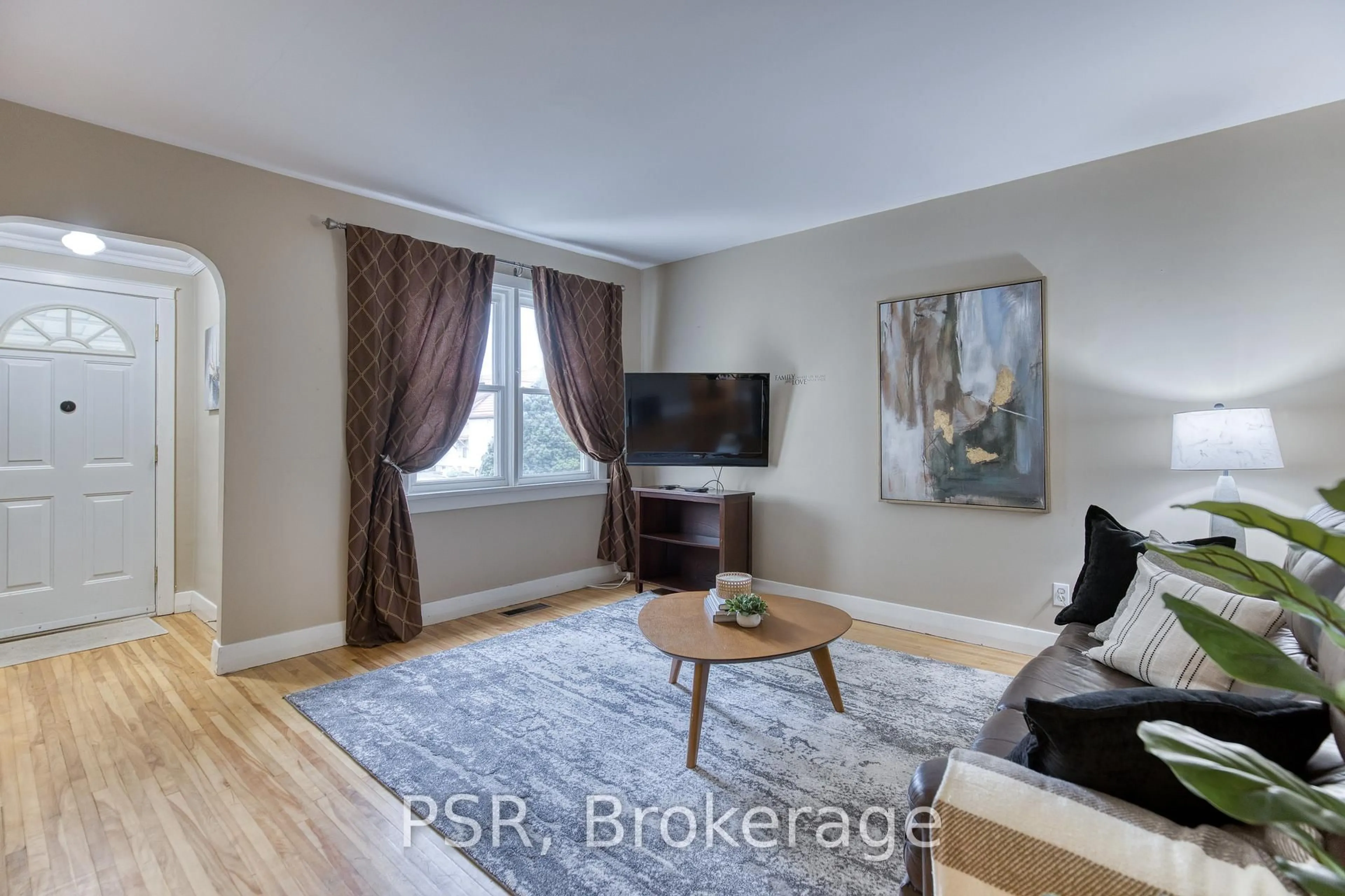 Living room with furniture, wood/laminate floor for 94 North Dr, Kitchener Ontario N2M 1K8