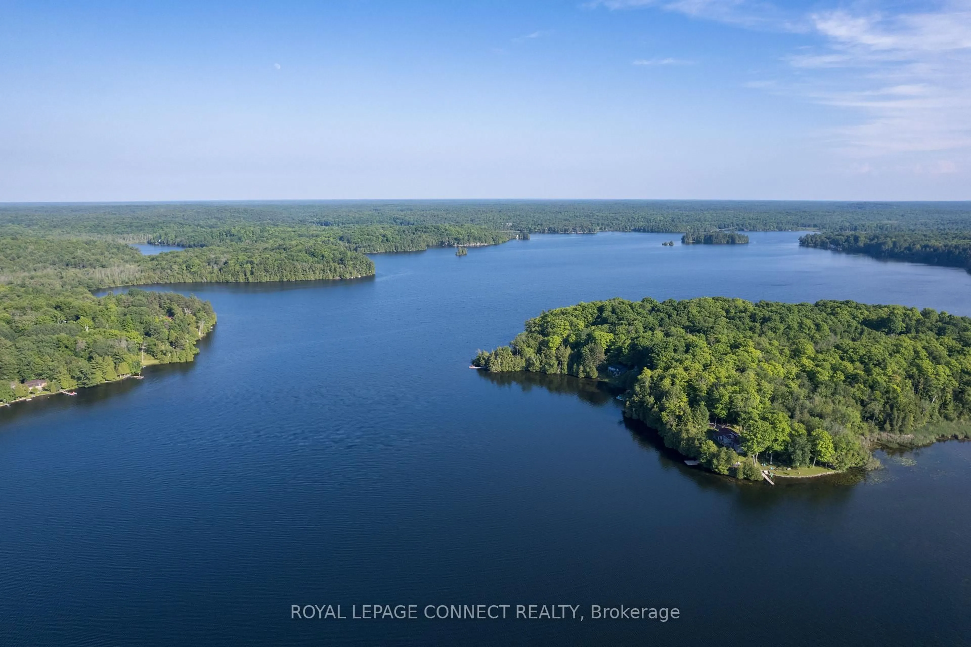 A pic from outside/outdoor area/front of a property/back of a property/a pic from drone, water/lake/river/ocean view for 1049 Johnston Rd, Arden Ontario K0H 1B0