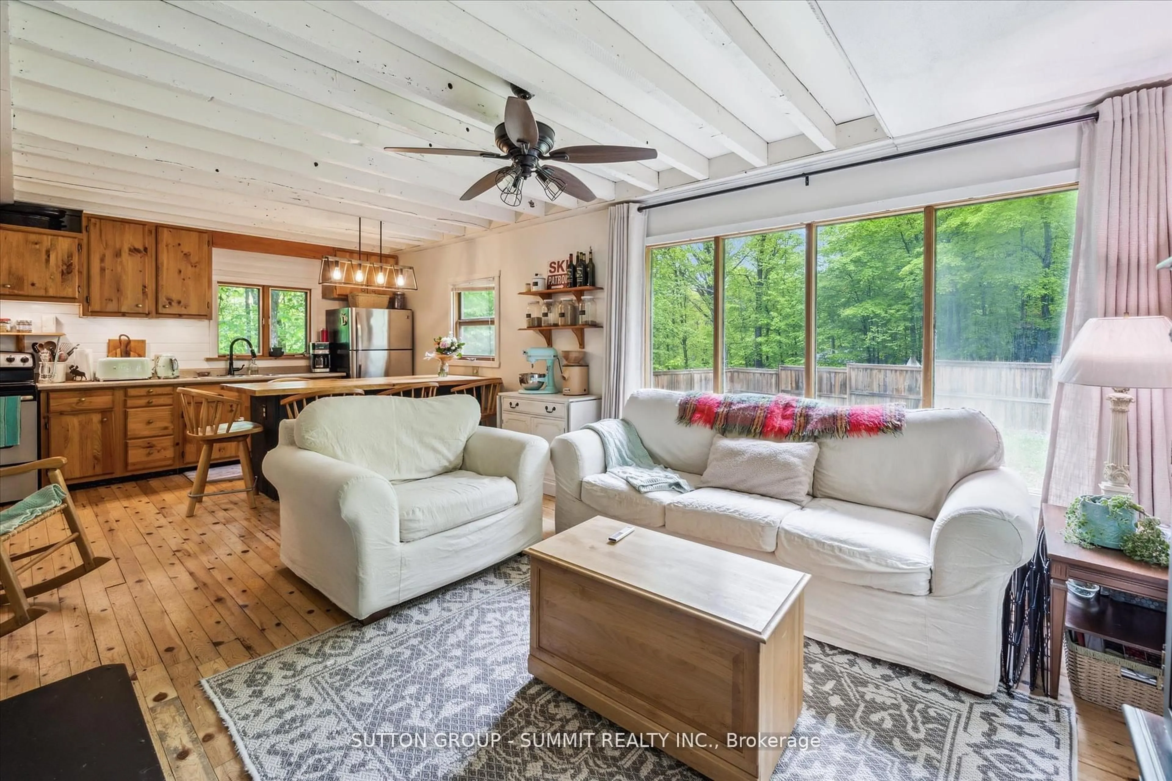 Living room with furniture, wood/laminate floor for 17 Sugarbush Lane, Huntsville Ontario P1H 2J3