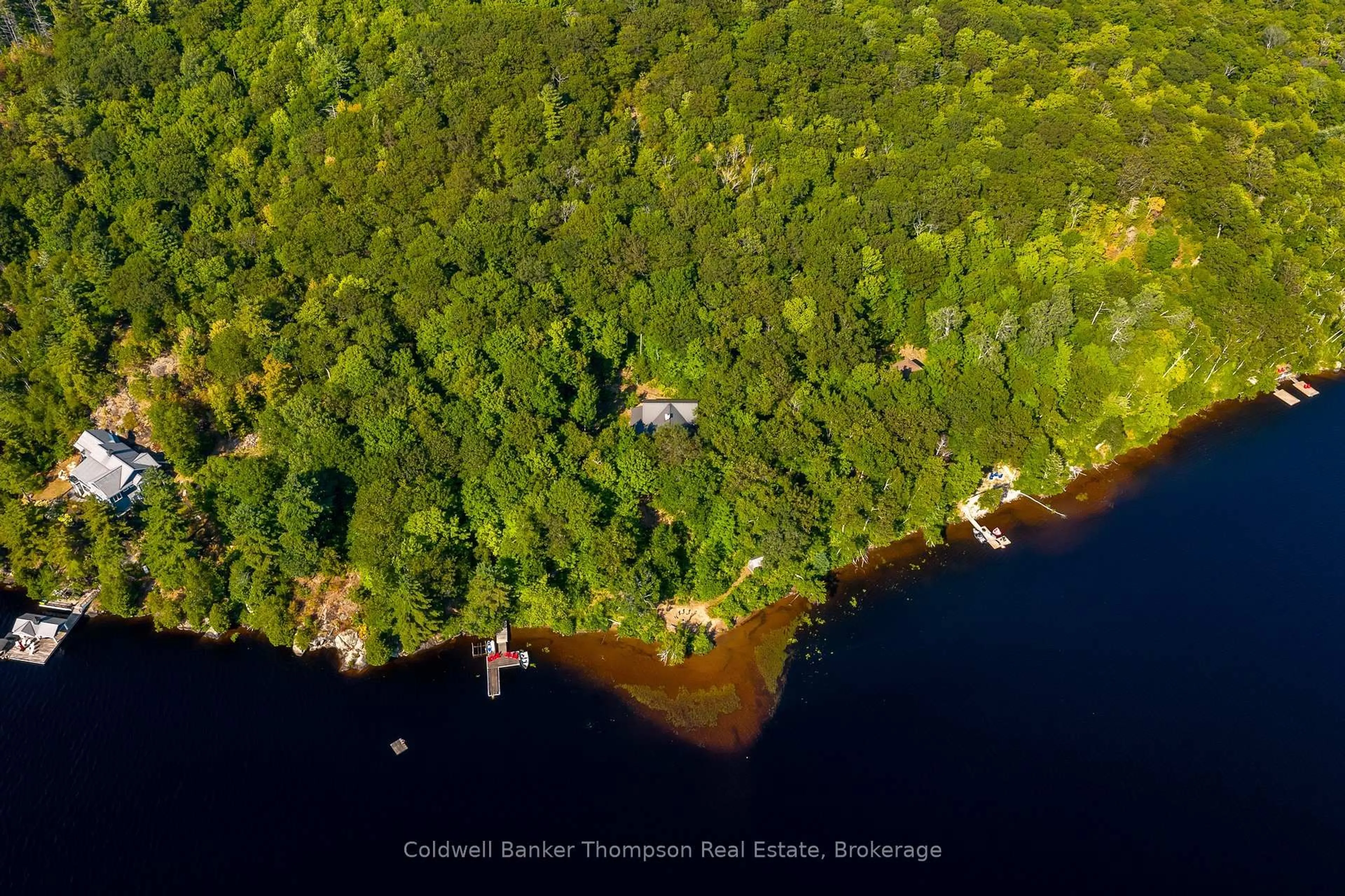 A pic from outside/outdoor area/front of a property/back of a property/a pic from drone, water/lake/river/ocean view for 778 Big Island, Huntsville Ontario P1H 2J2