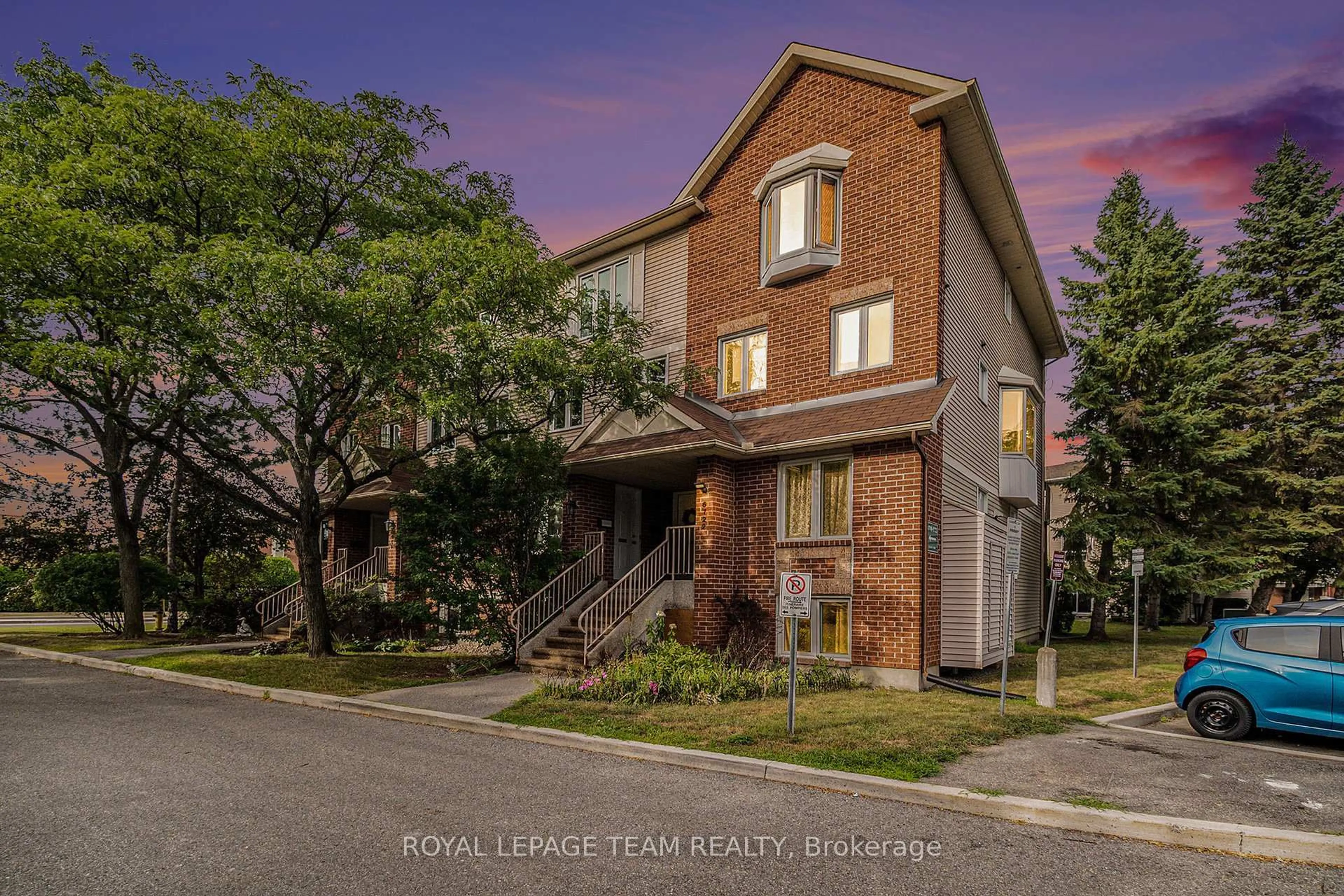 Home with brick exterior material, street for 6720 Jeanne D'Arc Blvd #B, Ottawa Ontario K1C 6E9