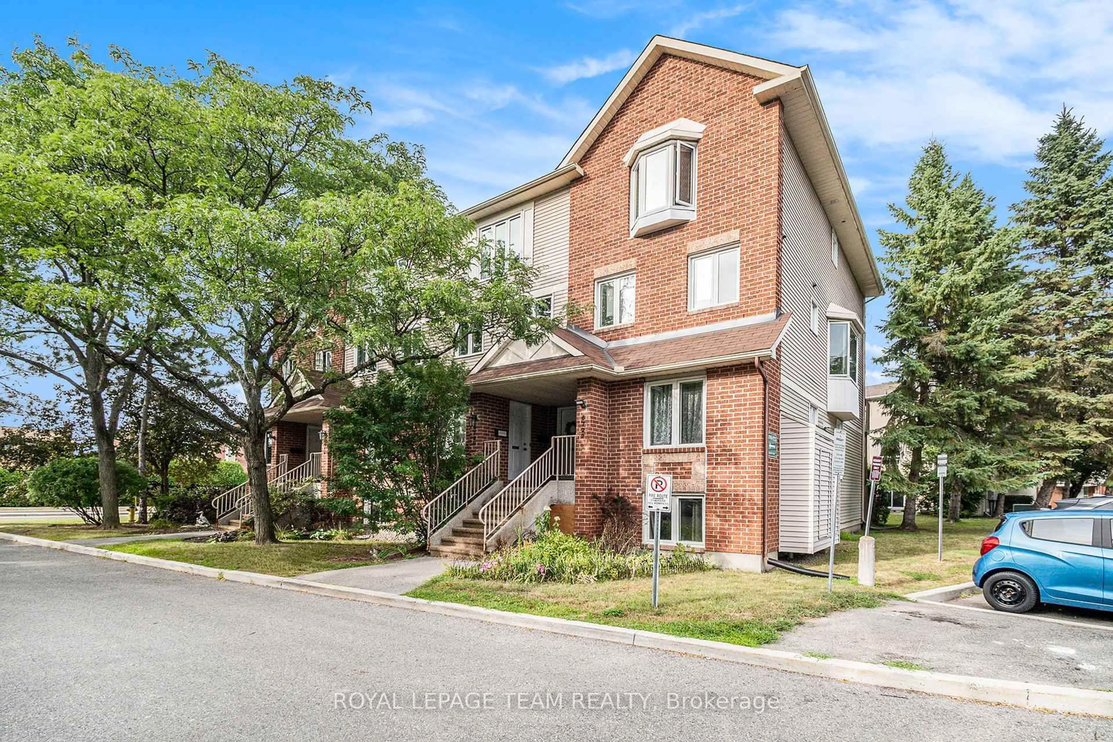 Home with brick exterior material, street for 6720 Jeanne D'Arc Blvd #B, Ottawa Ontario K1C 6E9