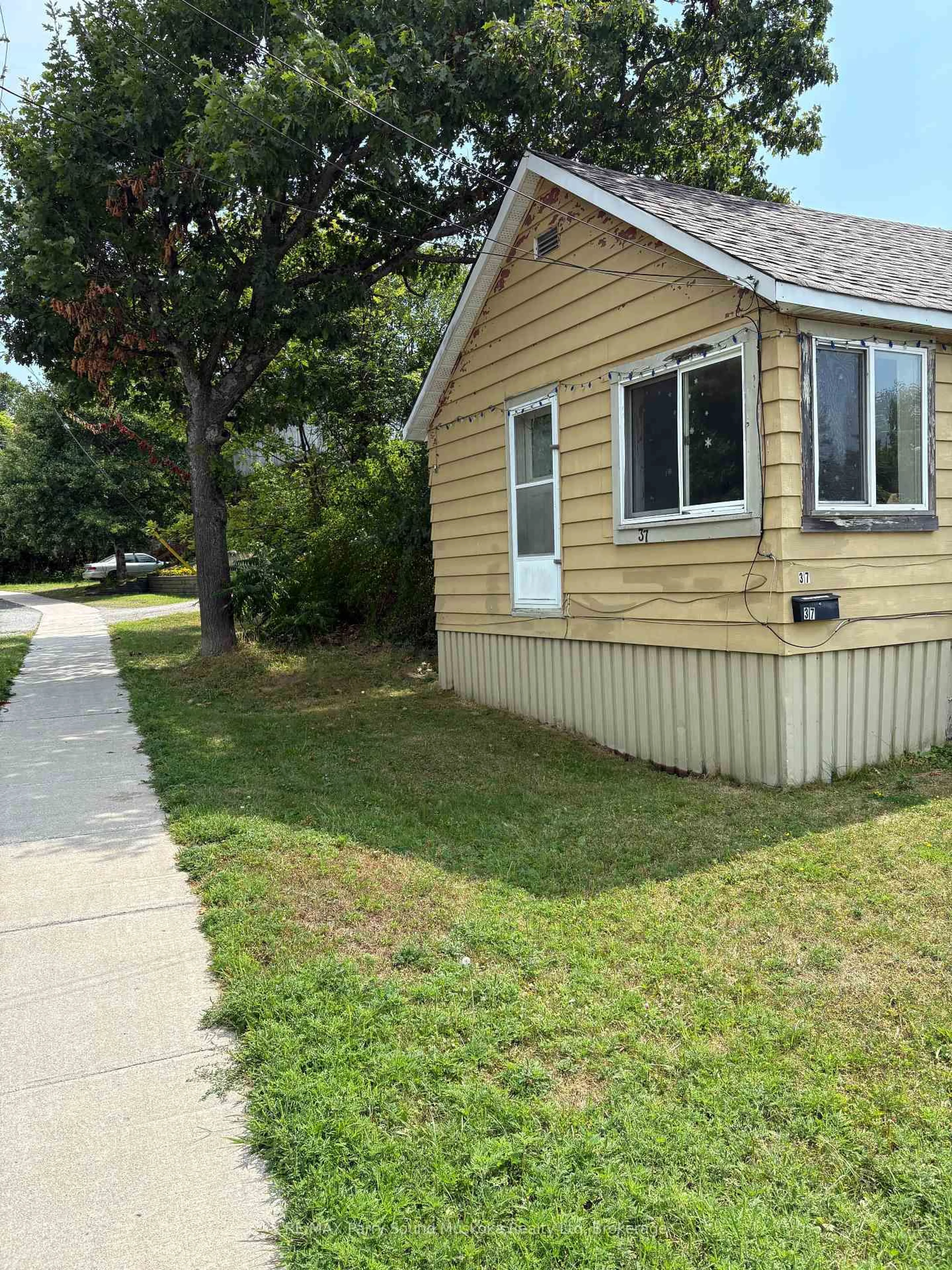 Home with vinyl exterior material, street for 37 Parry Sound Rd, Parry Sound Ontario P2A 2M5