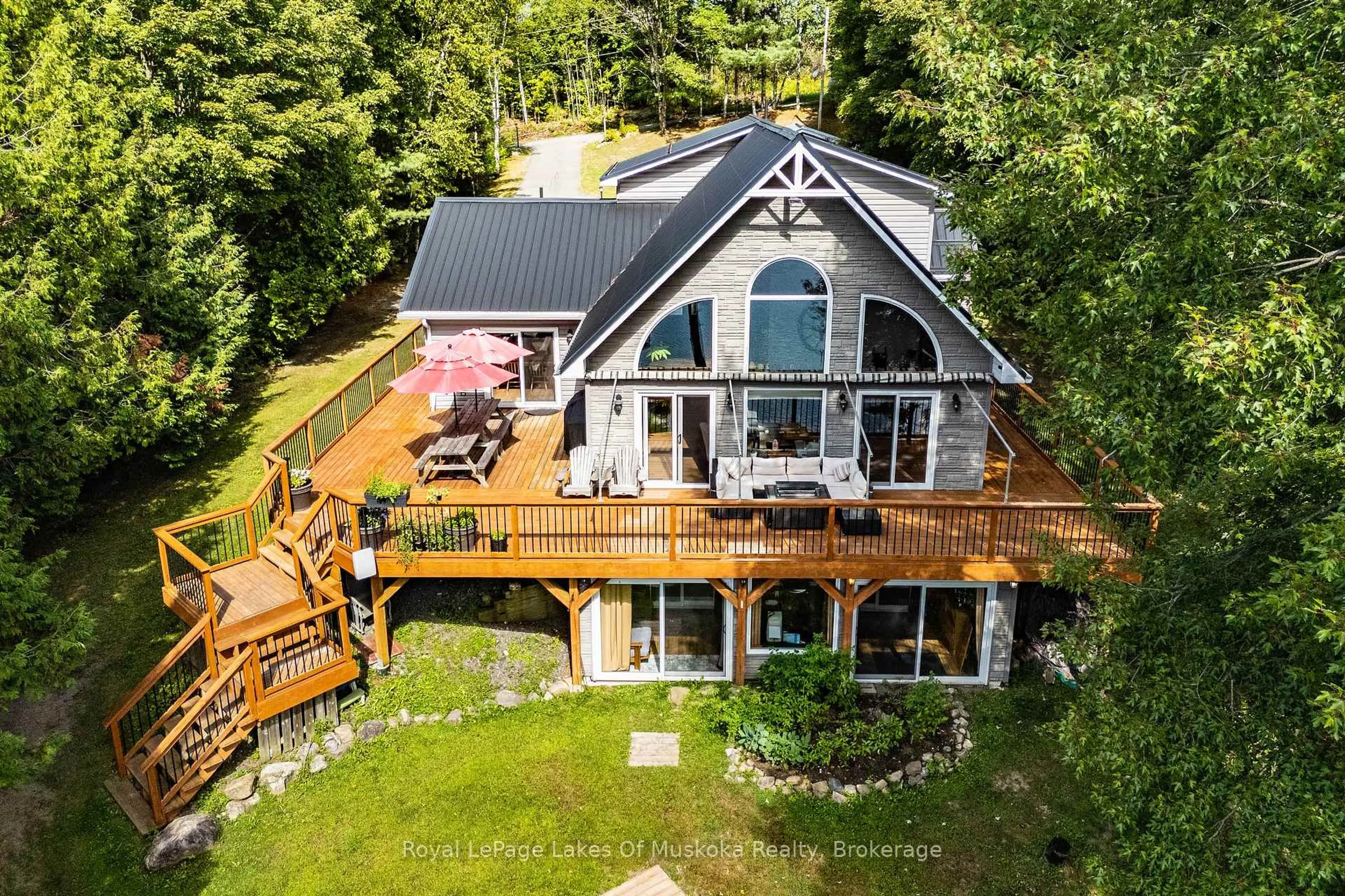 A pic from outside/outdoor area/front of a property/back of a property/a pic from drone, water/lake/river/ocean view for 1023 Carlo Enterprise Rd #16, Muskoka Lakes Ontario P0B 1M0