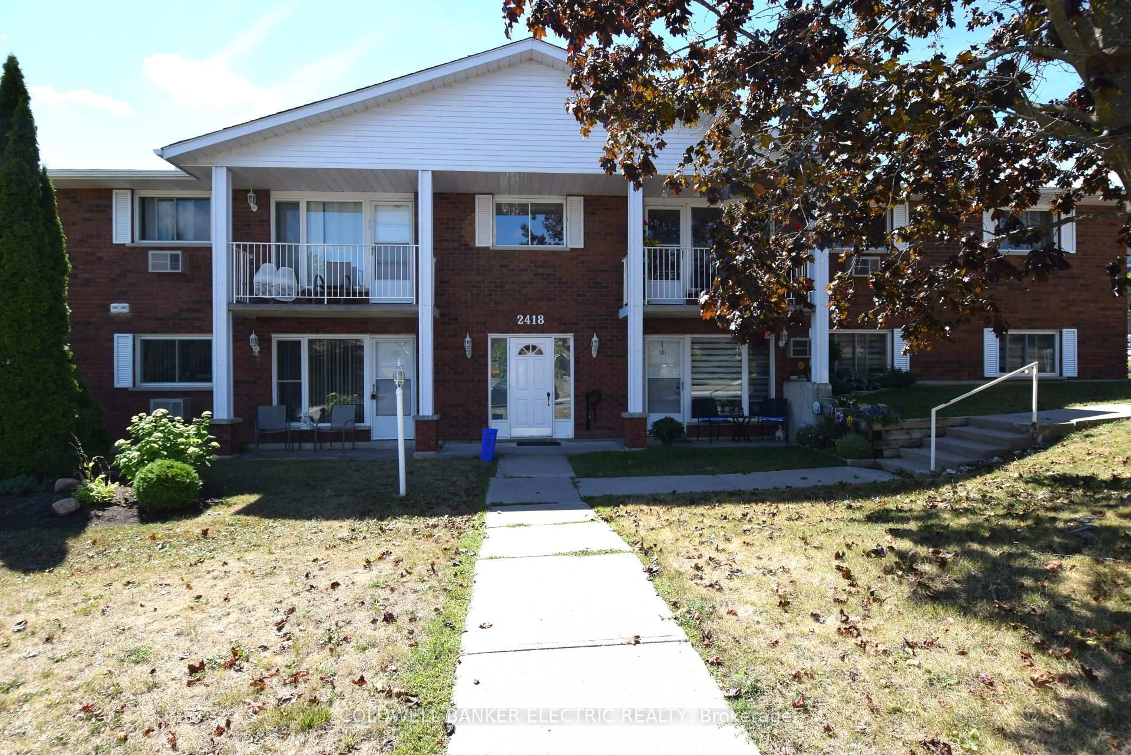 Home with brick exterior material, street for 2418 Mountland Dr #104, Peterborough Ontario K9K 2E2
