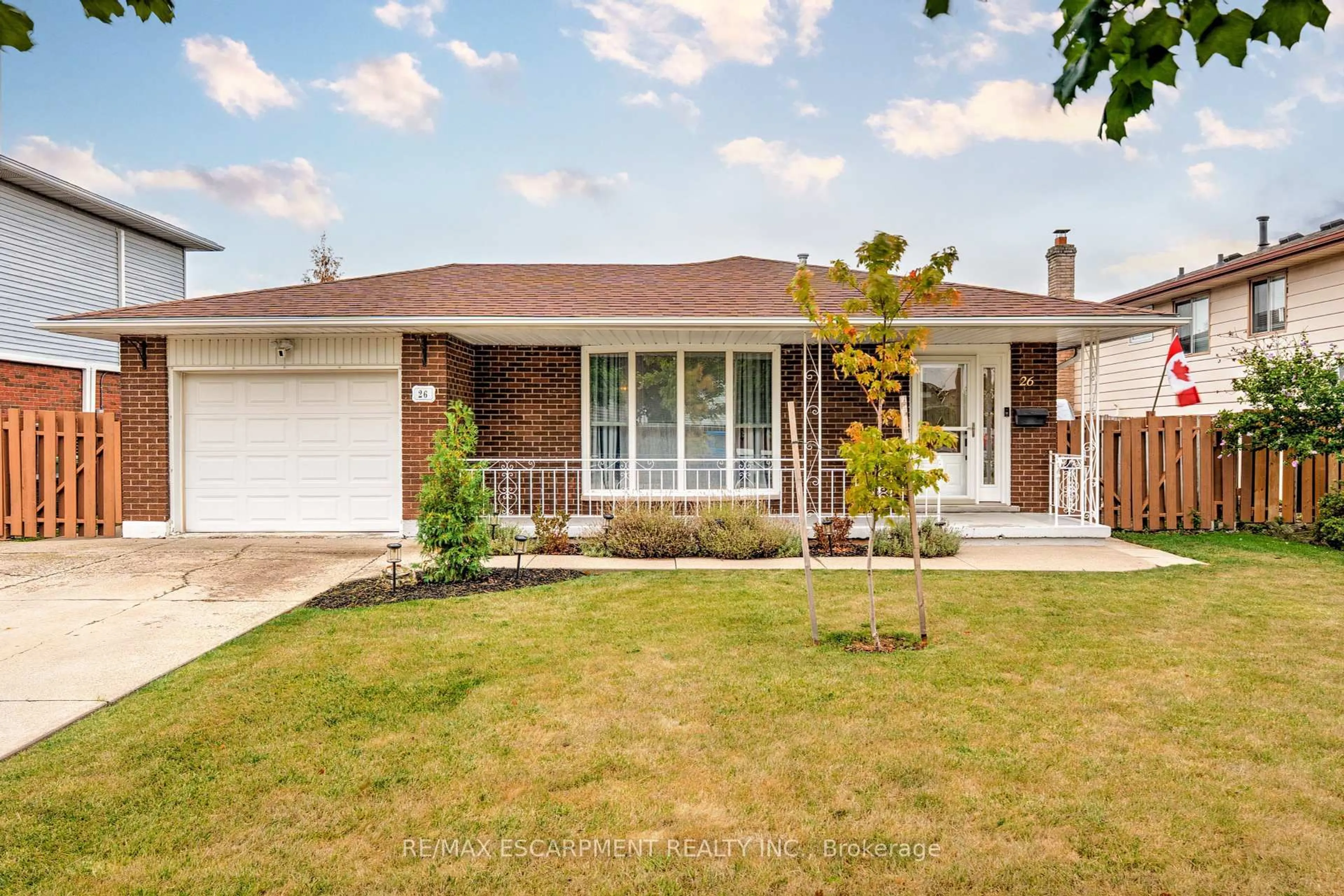Home with brick exterior material, street for 26 Madoc St, Hamilton Ontario L8E 3S7